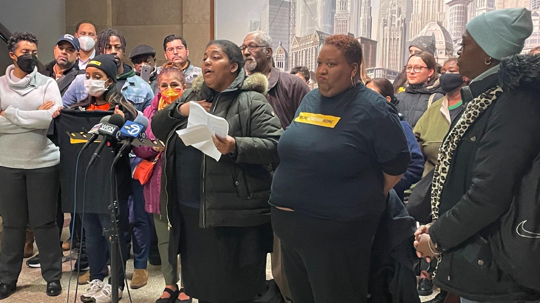 Members of the Chicago Coalition for the Homeless blast half of the City Council for failing to show up for a hearing on a proposal to tax the sale of properties worth more than  million to fight homelessness on Monday, Nov. 14. (Heather Cherone / WTTW News)