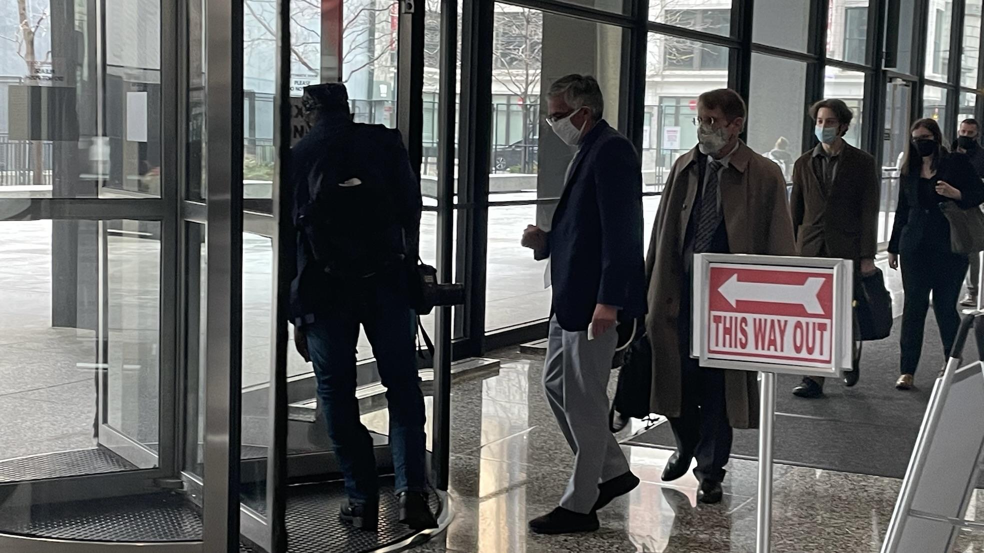 Former Ald. Ricardo Muñoz, center, leaves the Everett M. Dirksen U.S. Courthouse on March 17, 2022. (Heather Cherone / WTTW News)