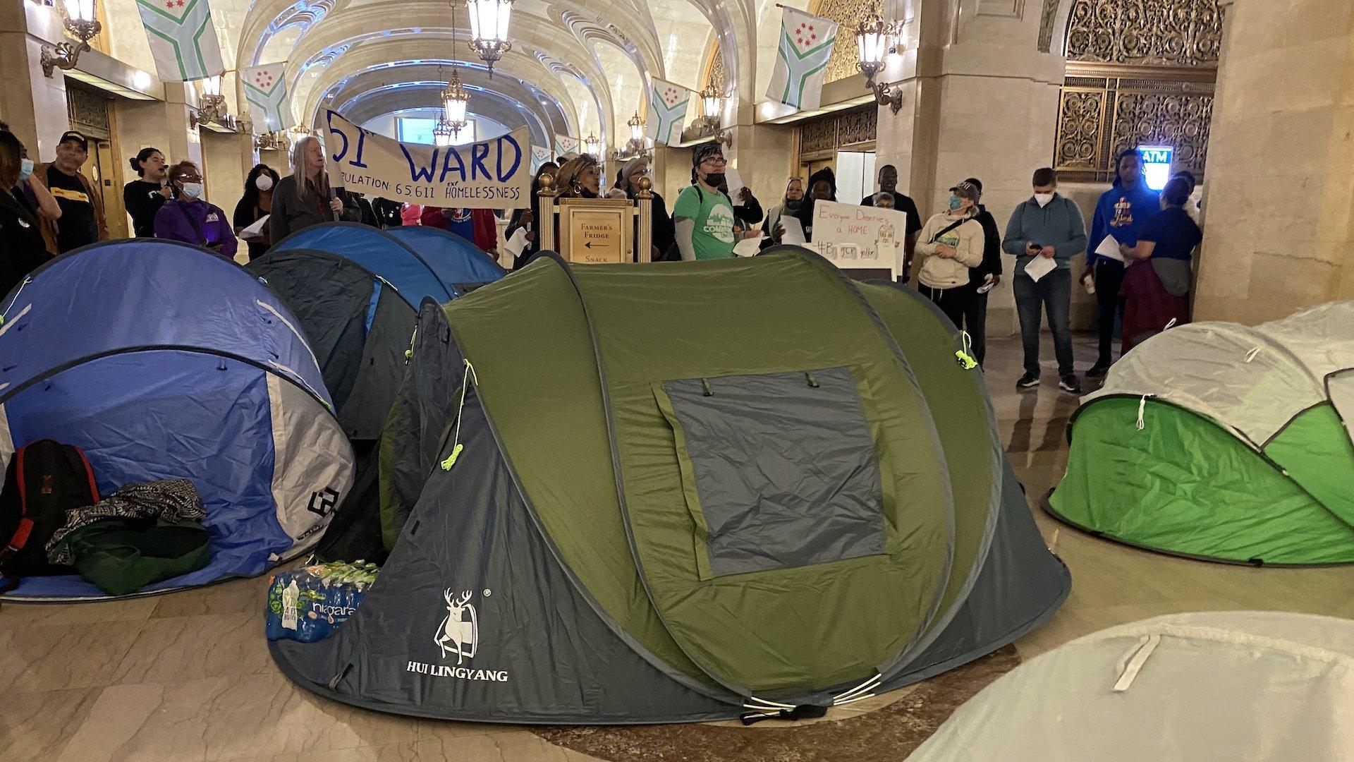 Advocates staged a tent city in the lobby of City Hall during Mayor Lori Lightfoot's budget address on Monday, Oct. 3, 2022, calling on Chicago to provide a dedicated stream of funding to tackle the problem of homelessness. (Nick Blumberg / WTTW News)