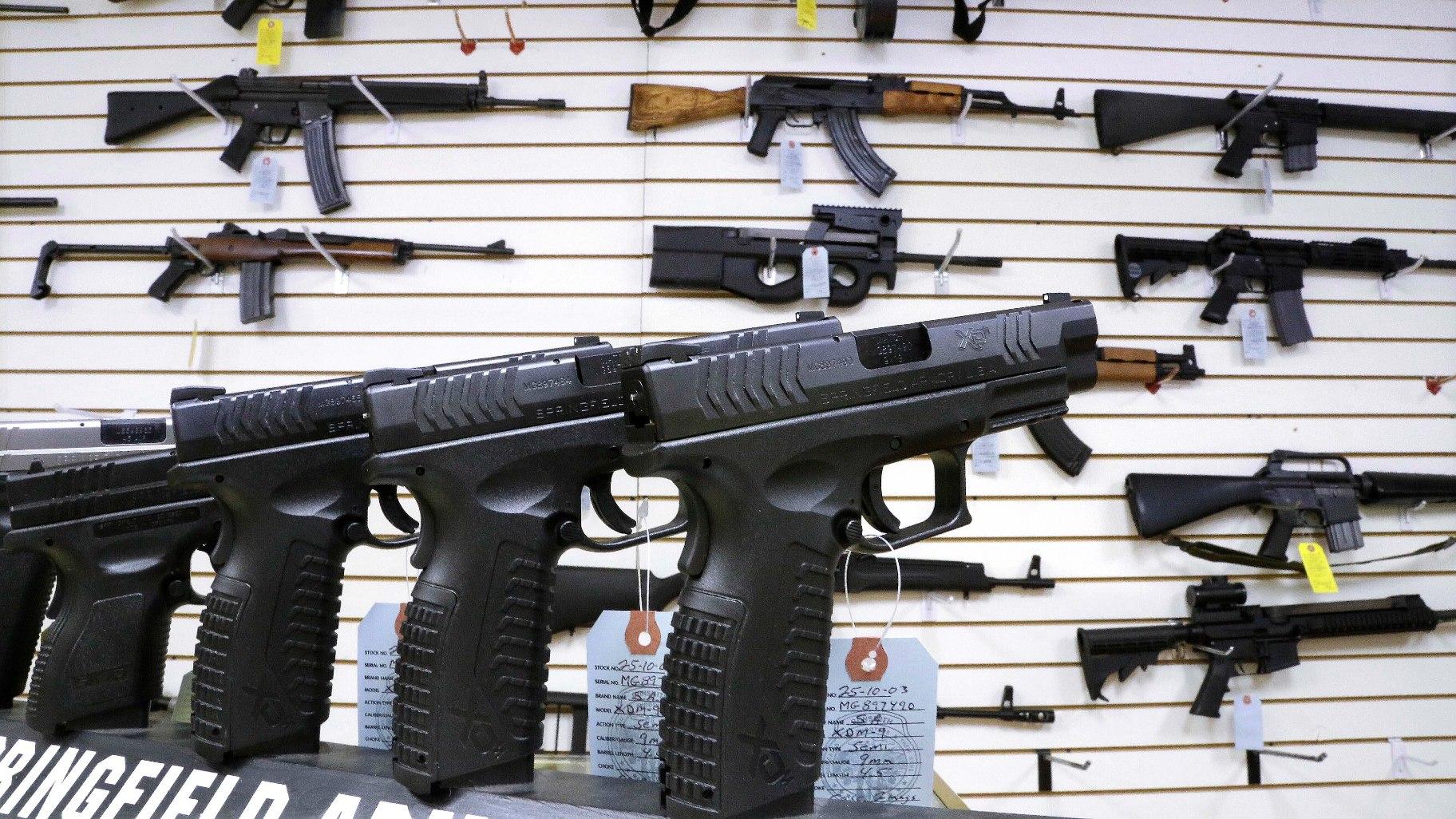 Semi-automatic guns are displayed for sale at Capitol City Arms Supply, Jan. 16, 2013, in Springfield, Ill. (AP Photo / Seth Perlman, File)