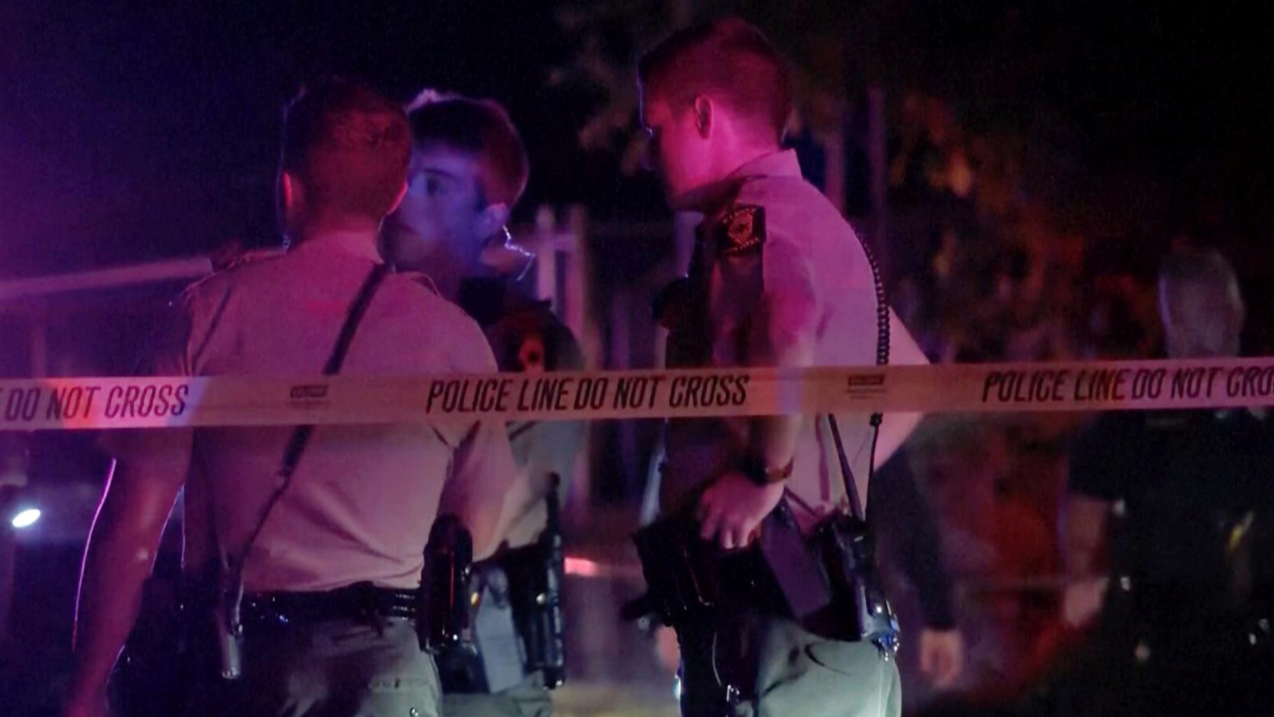 Law enforcement agents respond to the scene of a shooting late Wednesday, Aug. 30, 2023 in Peoria, Ill. Several people were shot and two of them were in critical condition, police said. (WEEK/WHOI via AP)