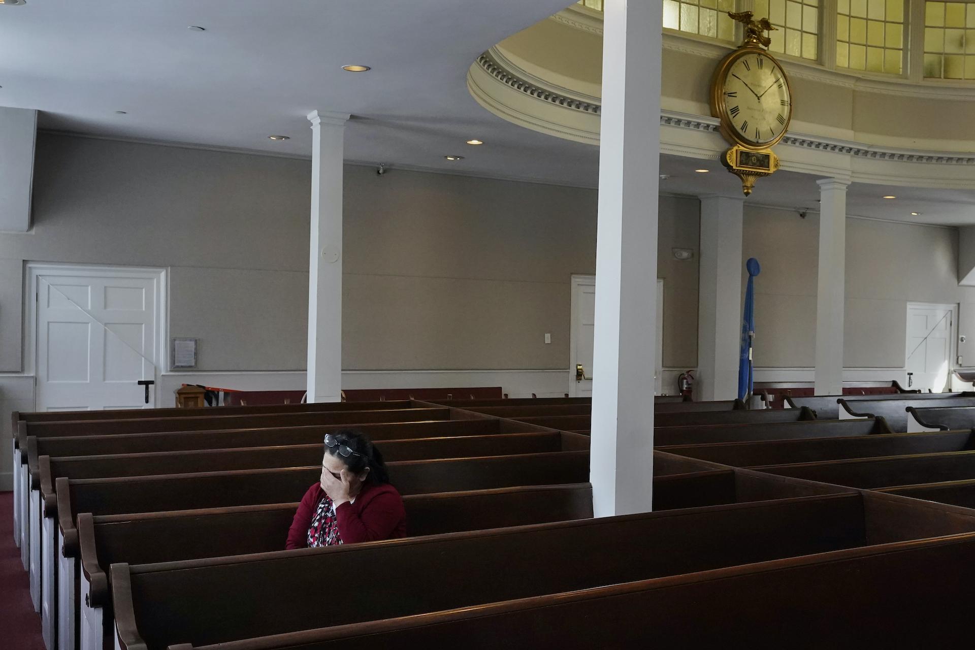 Maria Macario pauses as she talks about her family during an interview at the First Parish church, Friday, Jan. 29, 2021, in Bedford, Mass. (AP Photo/Charles Krupa)