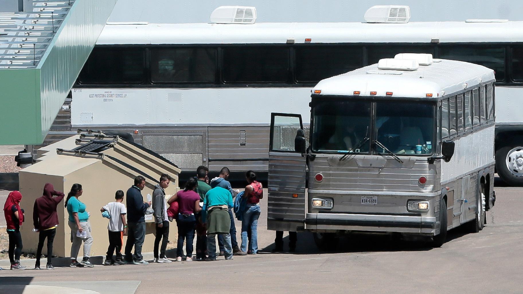 FILE - In this April 20, 2019 file photo, migrants are loaded onto a bus at the Border Patrol headquarters on Hondo Pass, in El Paso, Texas. (Mark Lambie / The El Paso Times via AP, File)