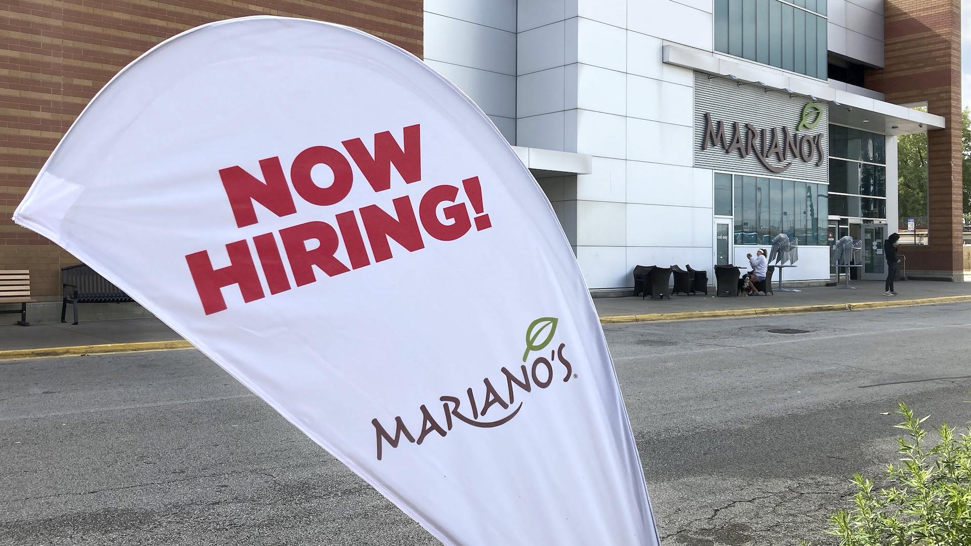 A sign in the parking lot of Mariano's grocery store advertises the availability of jobs Friday, Oct. 8, 2021, in Chicago. One reason America’s employers are having trouble filling jobs was starkly illustrated in a report Tuesday, Oct. 12: Americans are quitting in droves. (AP Photo/Charles Rex Arbogast)