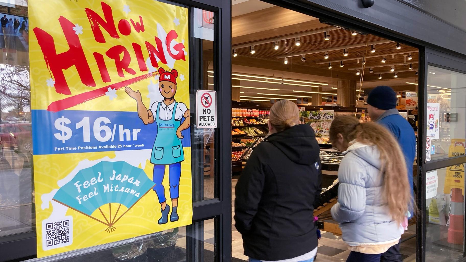 A hiring sign is displayed at a grocery store in Arlington Heights, Ill., Friday, Jan. 13, 2023. (AP Photo / Nam Y. Huh, File)