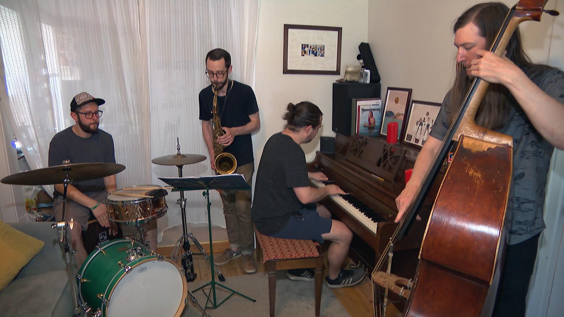 Chicago-based musician Juan Pastor, left, plays the cajon with his band Chinchano. (WTTW News)