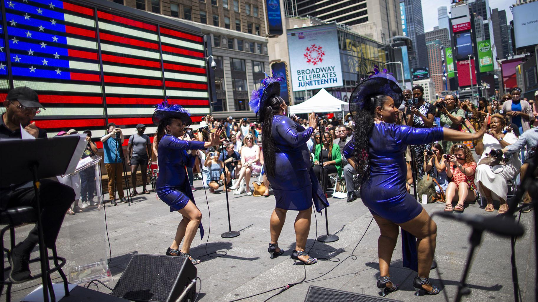 Selena Quinn, from left, LaVon Fisher-Wilson and Traci Coleman perform during a free outdoor event organized by The Broadway League as Juneteenth's celebrations take place at Times Square Saturday, June 19, 2021, in New York. (AP Photo / Eduardo Munoz Alvarez)