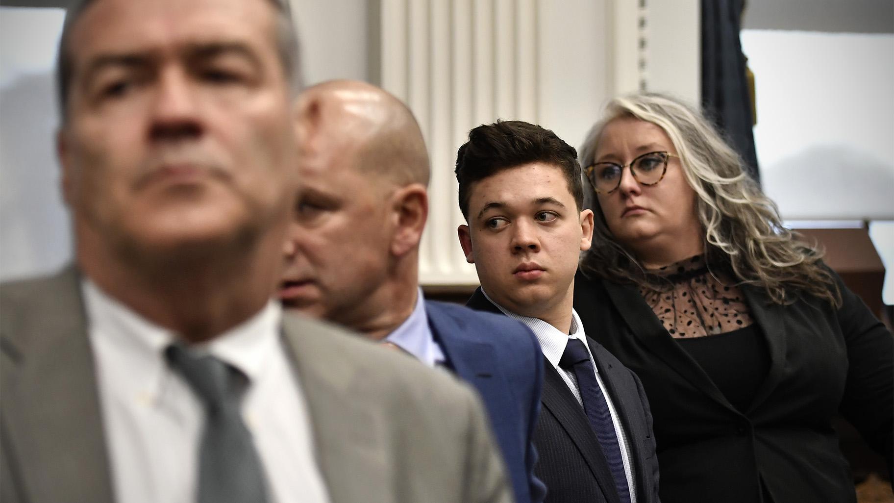 Kyle Rittenhouse, third from left, stands with his legal team, from left, Mark Richards, Corey Chirafisi and Natalie Wisco as the jury leaves the room for the day at the Kenosha County Courthouse in Kenosha, Wis., on Friday, Nov. 5, 2021. (Sean Krajacic / The Kenosha News via AP, Pool)