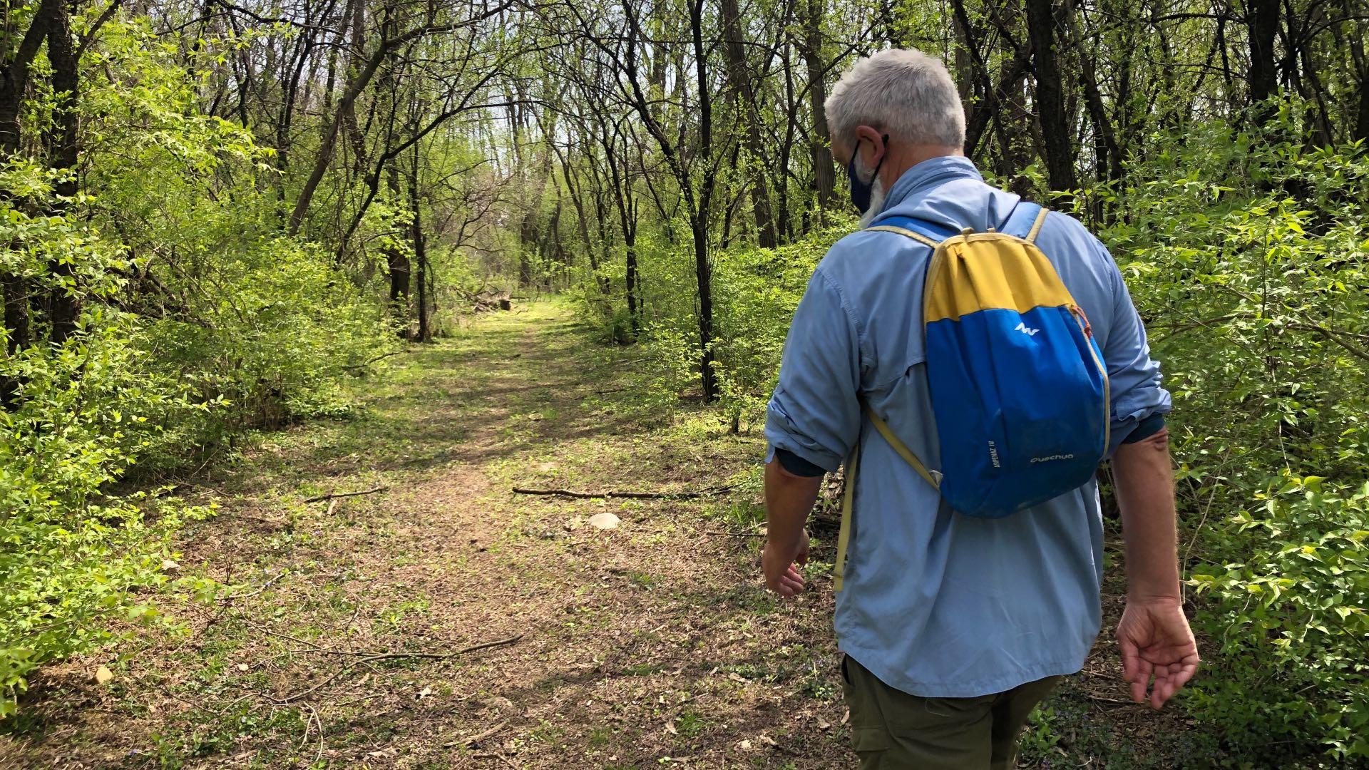 Liam Durnan hikes in Cook County’s Spring Lake Nature Preserve. (Patty Wetli / WTTW News)