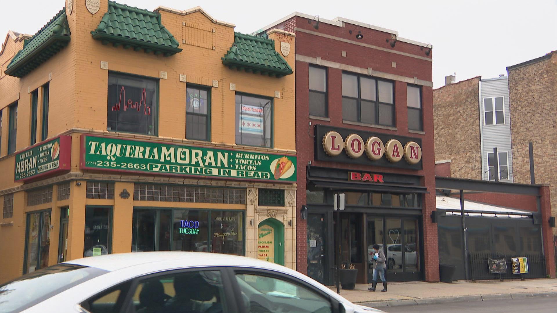 A lone pedestrian is seen walking along the street in Chicago’s Logan Square neighborhood on May 19, 2020. (WTTW News)