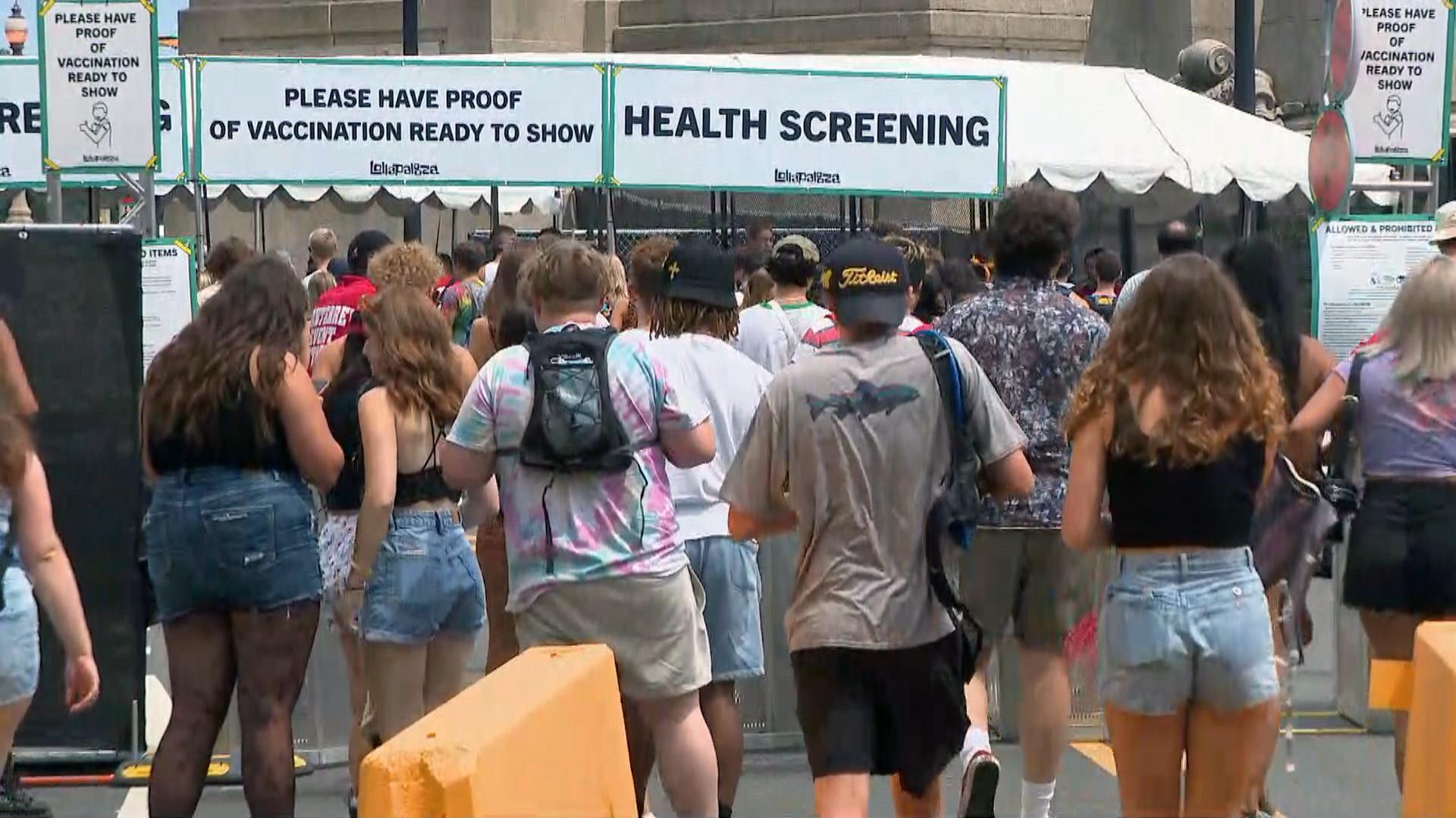 Music fans line up to enter Lollapalooza on the first day of the festival, which returns to Grant Park from July 29 through Aug. 1, 2021. (WTTW News)