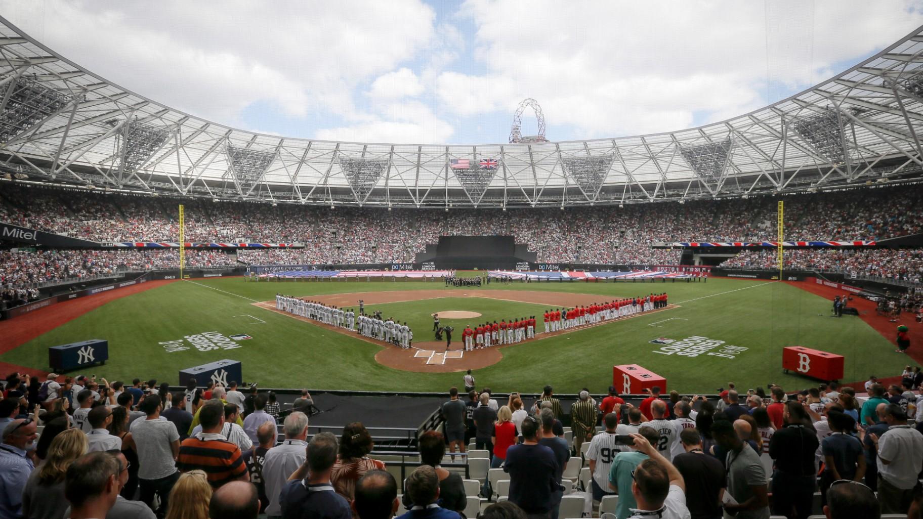 The New York Yankees, left, and the Boston Red Sox lineup for the national anthem before a baseball game in London on June 30, 2019. (AP Photo / Tim Ireland, File)