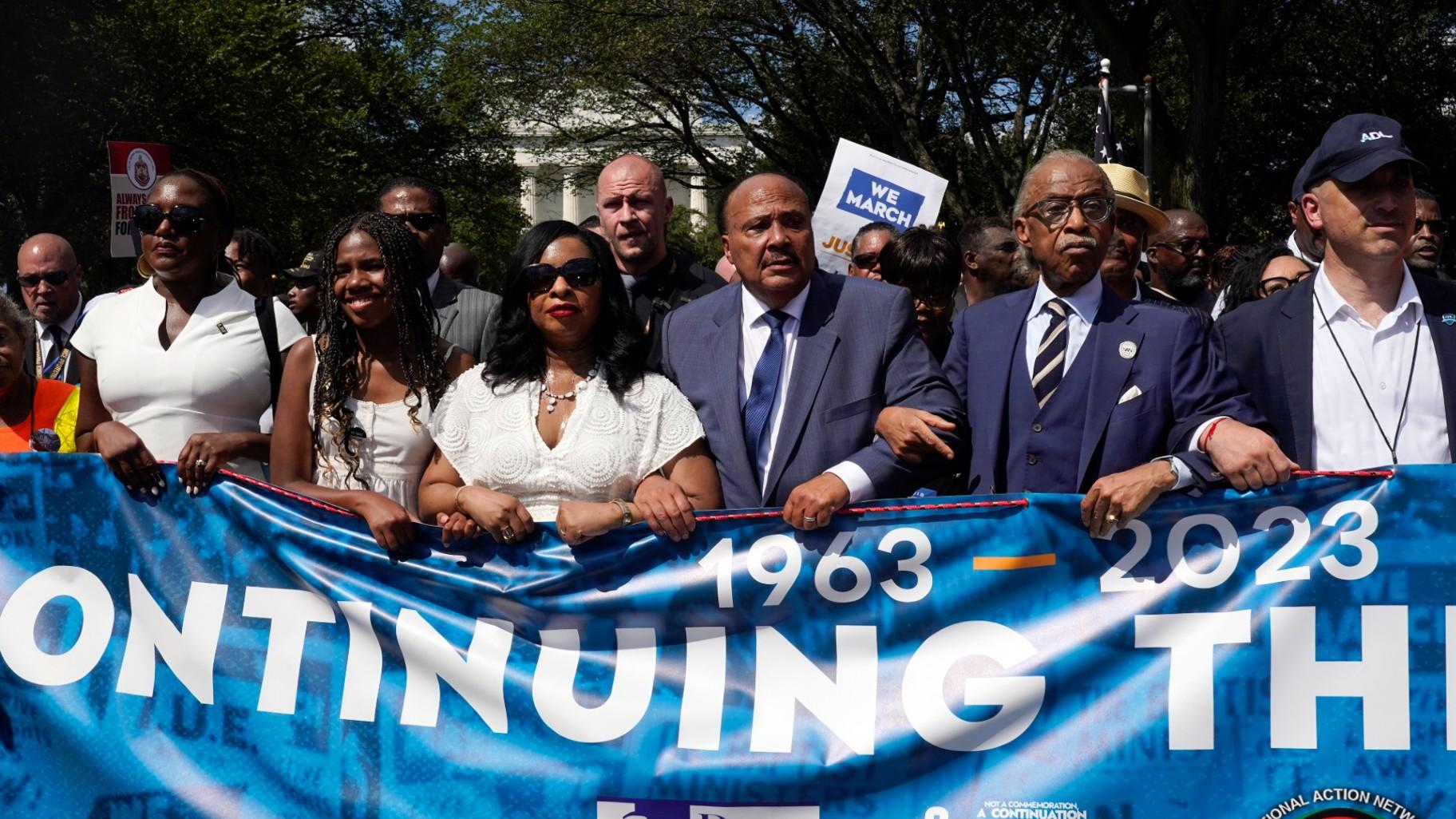 The Rev. Al Sharpton, second from right, joins Martin Luther King III, the son of Martin Luther King Jr., third from left, his wife Arndrea Waters King and their daughter Yolanda King as they march to honor the 60th Anniversary of the March on Washington, Saturday, Aug. 26, 2023, in Washington. (AP Photo / Jacquelyn Martin)
