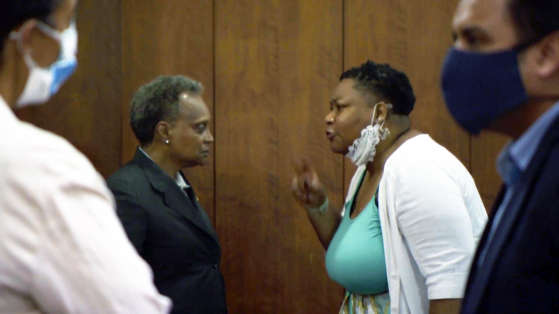 Mayor Lori Lightfoot, left, listens to Ald.  Jeanette Taylor (20th Ward) responds to her request to allow the Chicago City Council to vote to confirm Celia Meza as the city's top lawyer at a city council meeting on Wednesday, June 23, 2021. (WTTW News)