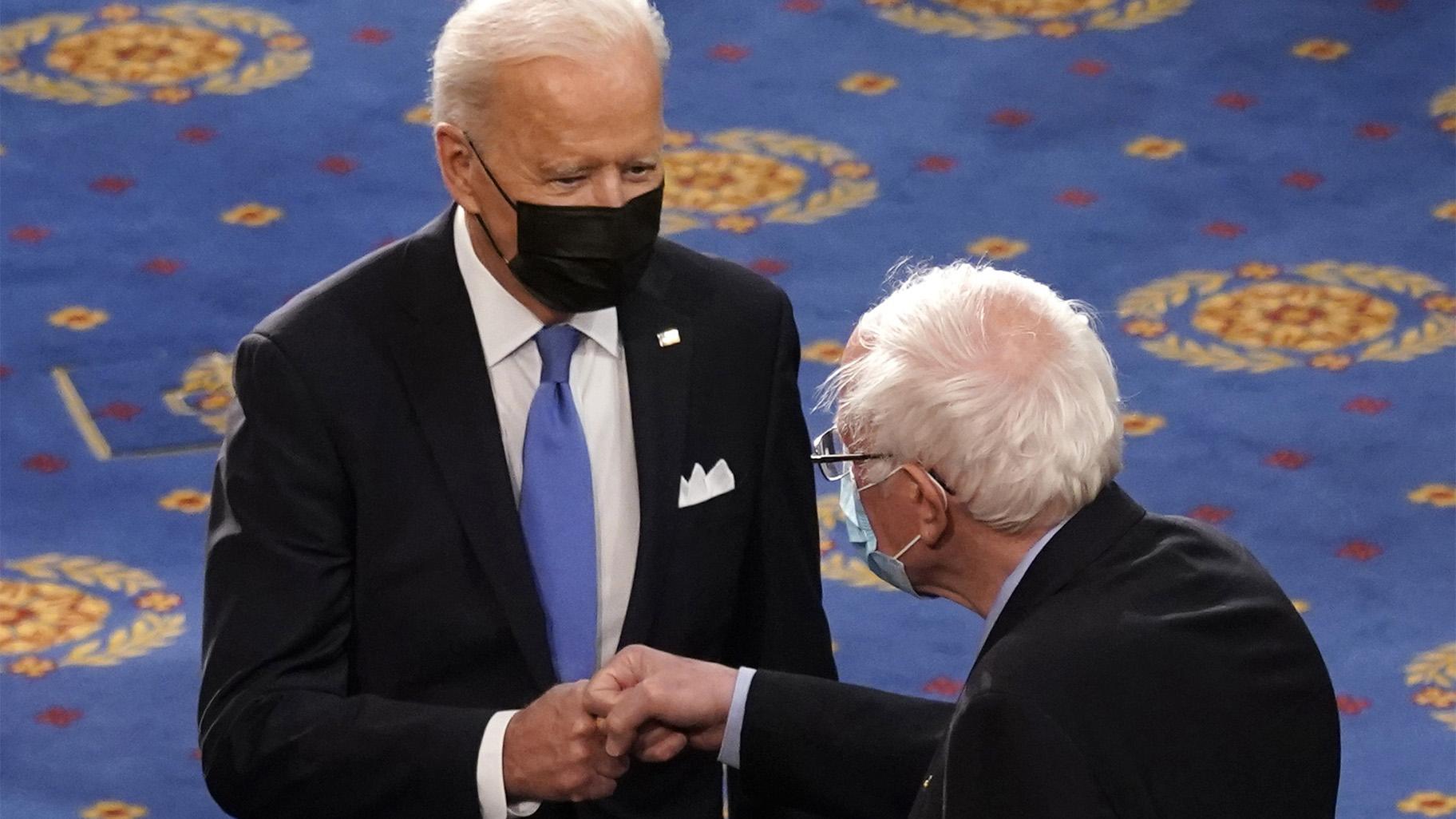 FILE - In this April 28, 2021 file photo, President Joe Biden greets Sen. Bernie Sanders, I-Vt., as Biden arrives to speak to a joint session of Congress in the House Chamber at the U.S. Capitol in Washington. (AP Photo / Andrew Harnik, Pool)