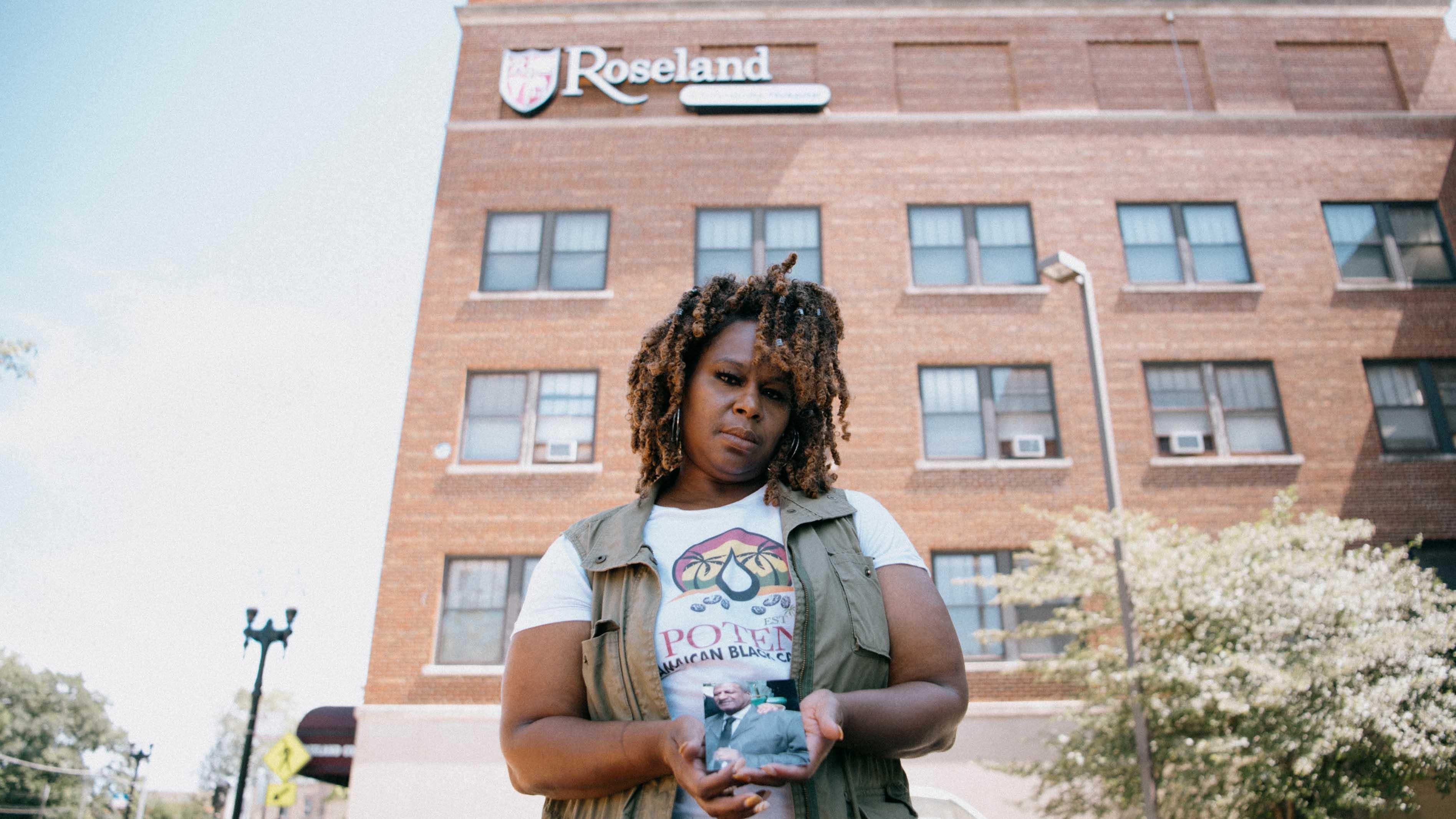 Melichsia Boss, holding a photograph of her father, Wilford. (Akilah Townsend for ProPublica)