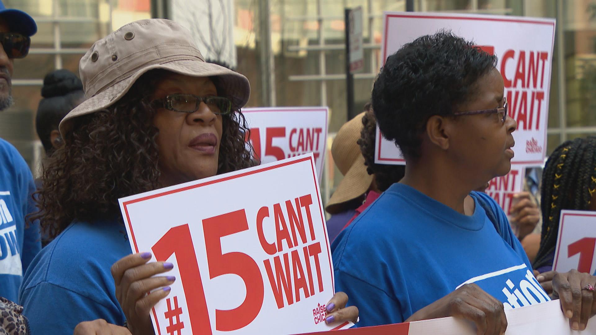 Labor activists join some public officials downtown for a rally in support of raising the minimum wage in August 2019. (WTTW News)