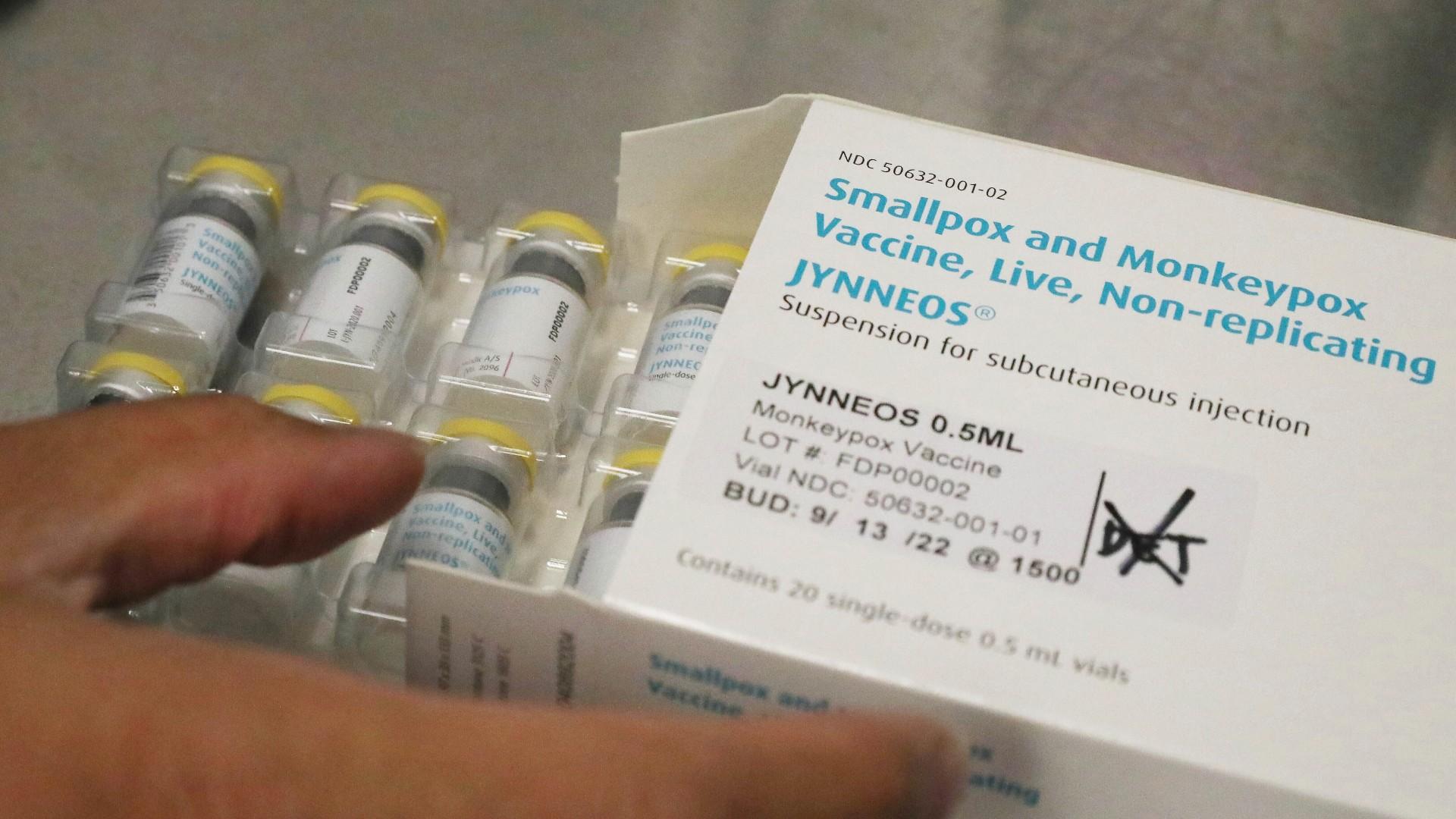 Jonathan Parducho, a pharmacist, removes a tray of vials of the Jynneos vaccine for monkeypox from a box containing 20 doses, in the vaccine hub at Zuckerberg San Francisco General Hospital, July 29, 2022, in San Francisco. (Lea Suzuki / San Francisco Chronicle via AP)