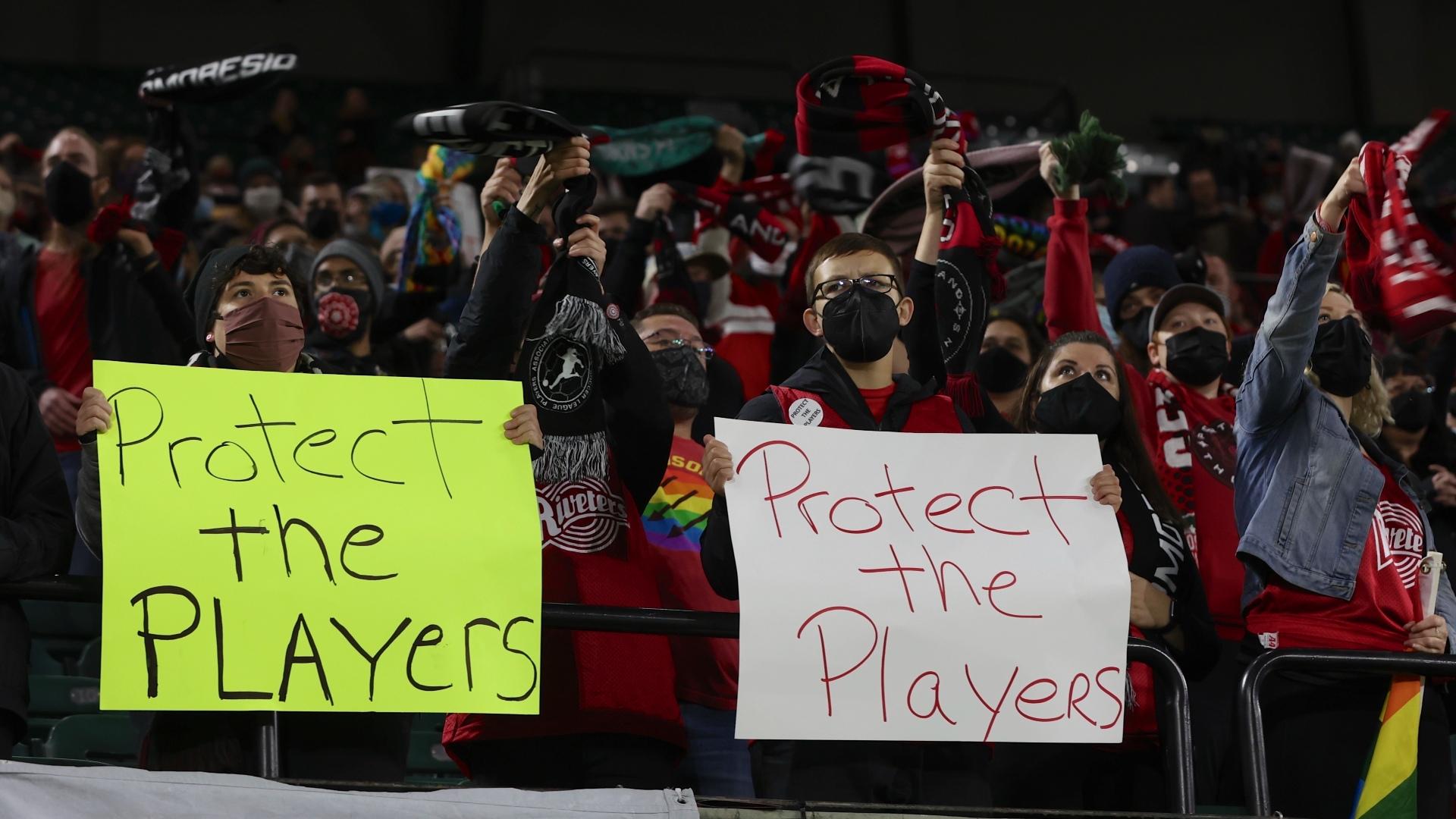 Portland Thorns fans hold signs during the first half of the team's National Women's Soccer League soccer match against the Houston Dash in Portland, Ore., Oct. 6, 2021. An investigation commissioned by the NWSL and its players union found “widespread misconduct” directed at players dating back to the beginnings nearly a decade ago of the country's top women's professional league. (AP Photo / Steve Dipaola, File)