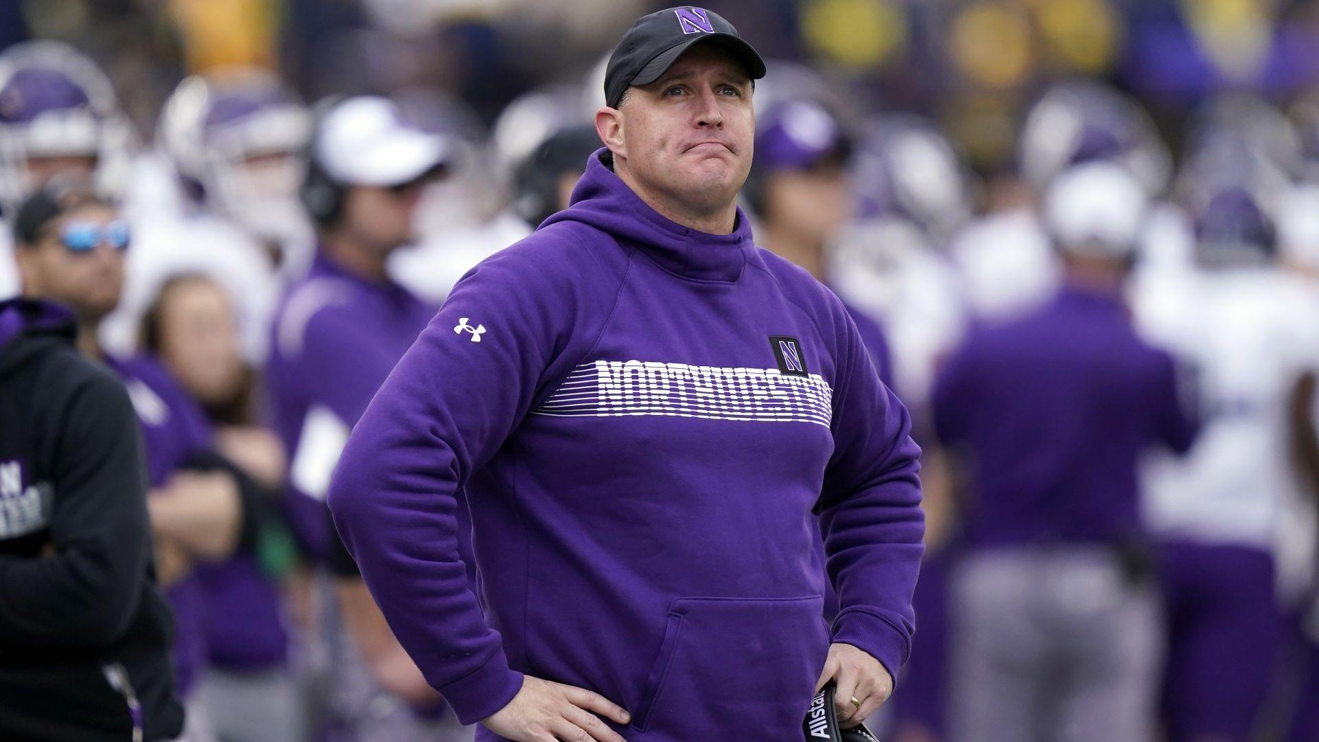 Northwestern head coach Pat Fitzgerald stands on the sideline during the first half of an NCAA college football game against Michigan, Oct. 23, 2021, in Ann Arbor, Mich. (AP Photo/Carlos Osorio, File)