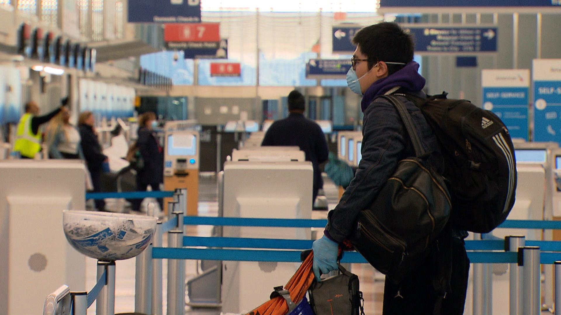 A passenger waits in line at O’Hare International Airport on Wednesday, April 29, 2020. (WTTW News)