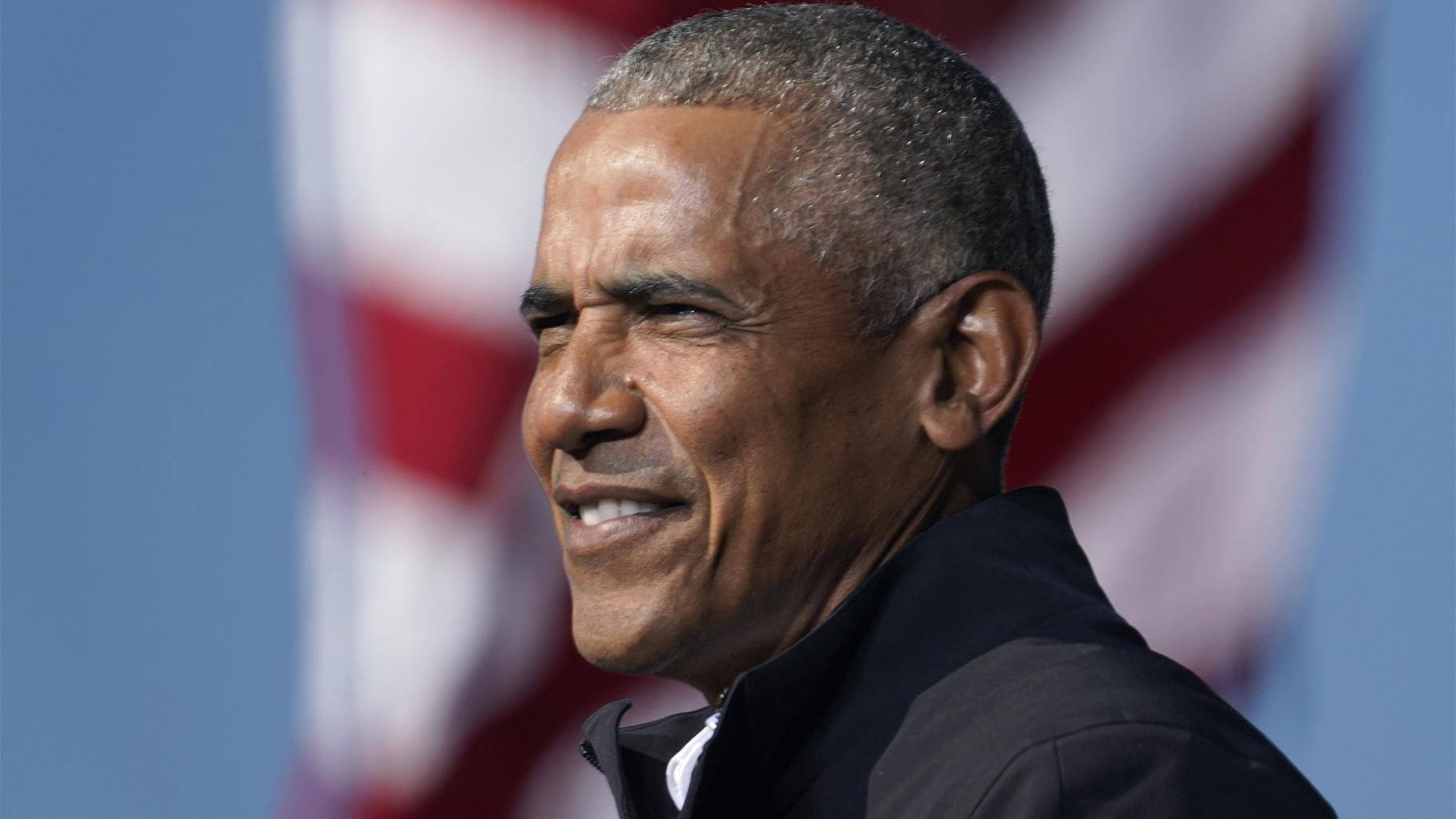 FILE - In this Nov. 2, 2020 file photo, former President Barack Obama speaks at a rally as he campaigns for Democratic presidential candidate former Vice President Joe Biden at Turner Field in Atlanta. (AP Photo / Brynn Anderson)