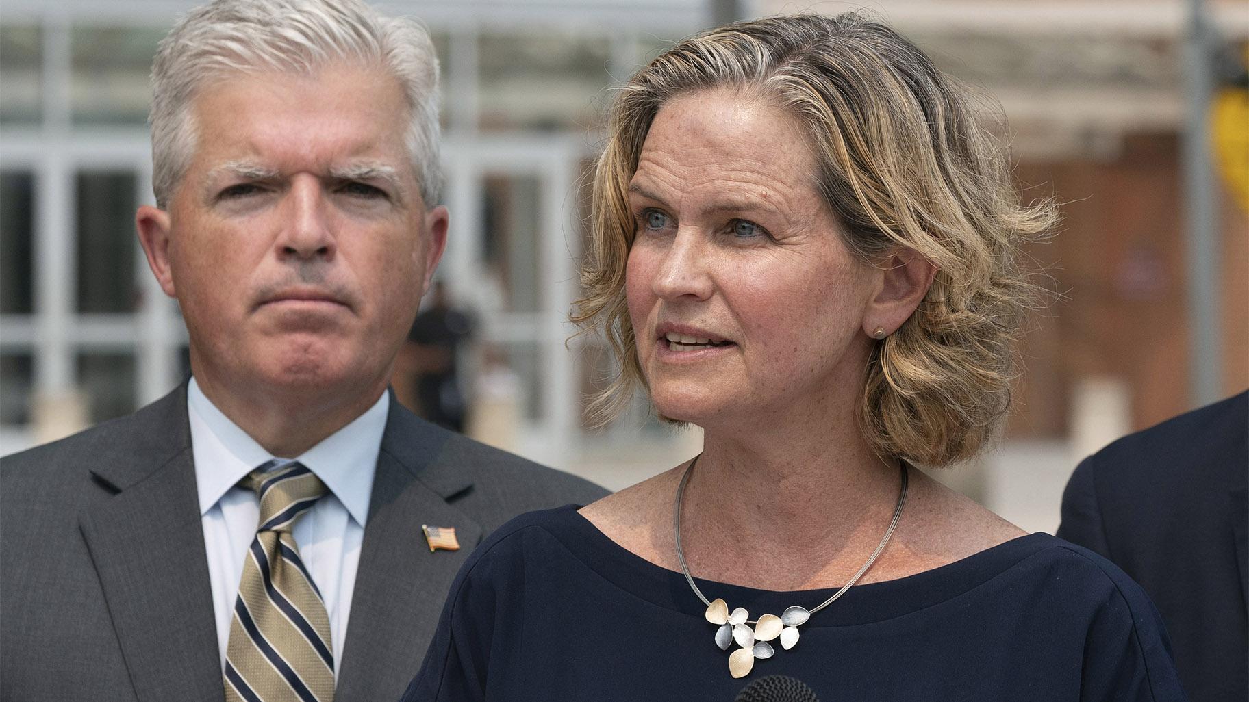 Nassau County Executive Laura Curran, right, speaks at a news conference to discuss a settlement in an opioid trial, Tuesday, July 20, 2021, in Central Islip, N.Y. Suffolk County Executive Steve Bellone is behind her. (AP Photo / Mark Lennihan)