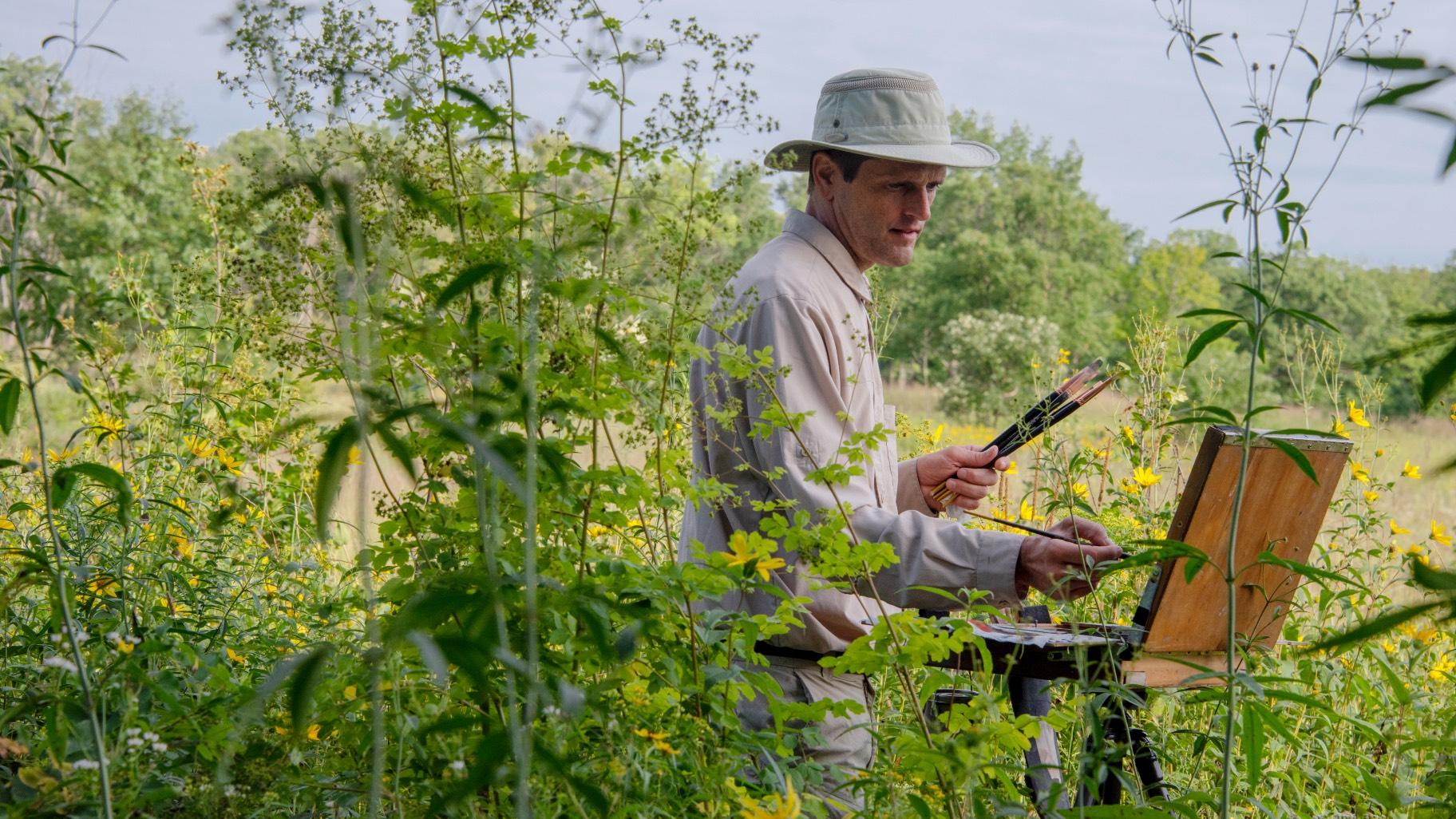 Artist Philip Juras painting at Somme Prairie Grove in Cook County. (Credit Robin Carlson)