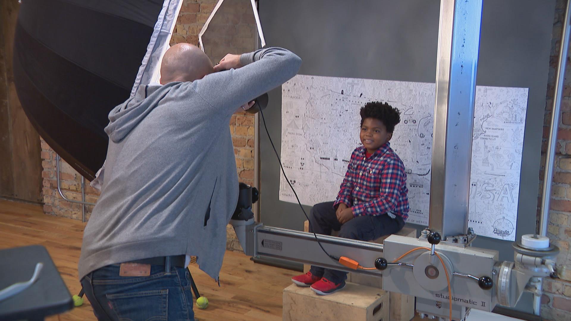 Chicago photographer Jeff Dahlgren takes a portrait at Throop Studio. (WTTW News)