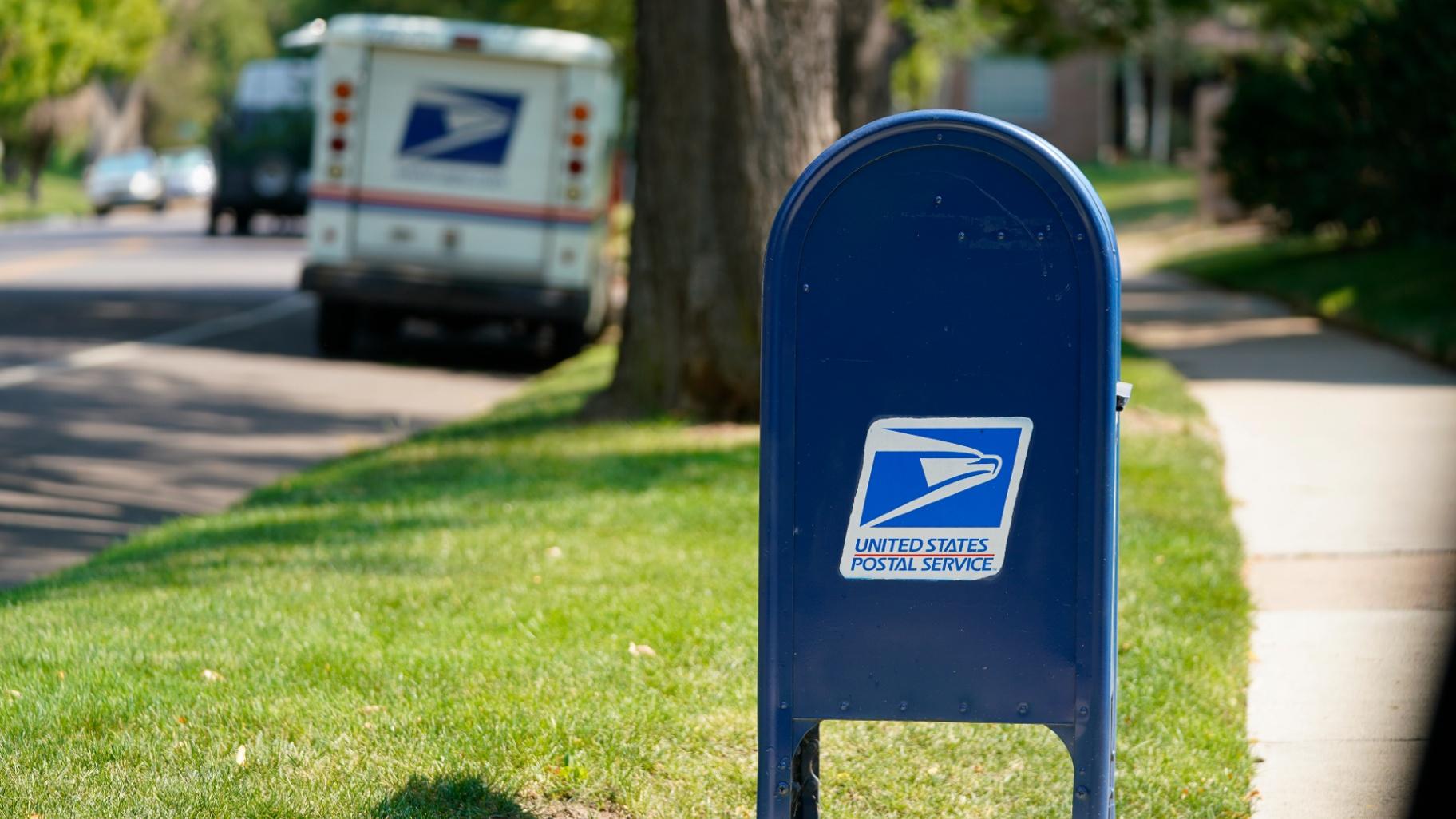 FILE - A United States Postal Service mailbox stands along Bonnie Brae Boulevard Monday, Aug. 17, 2020, in southeast Denver. (David Zalubowski / AP Photo, file)