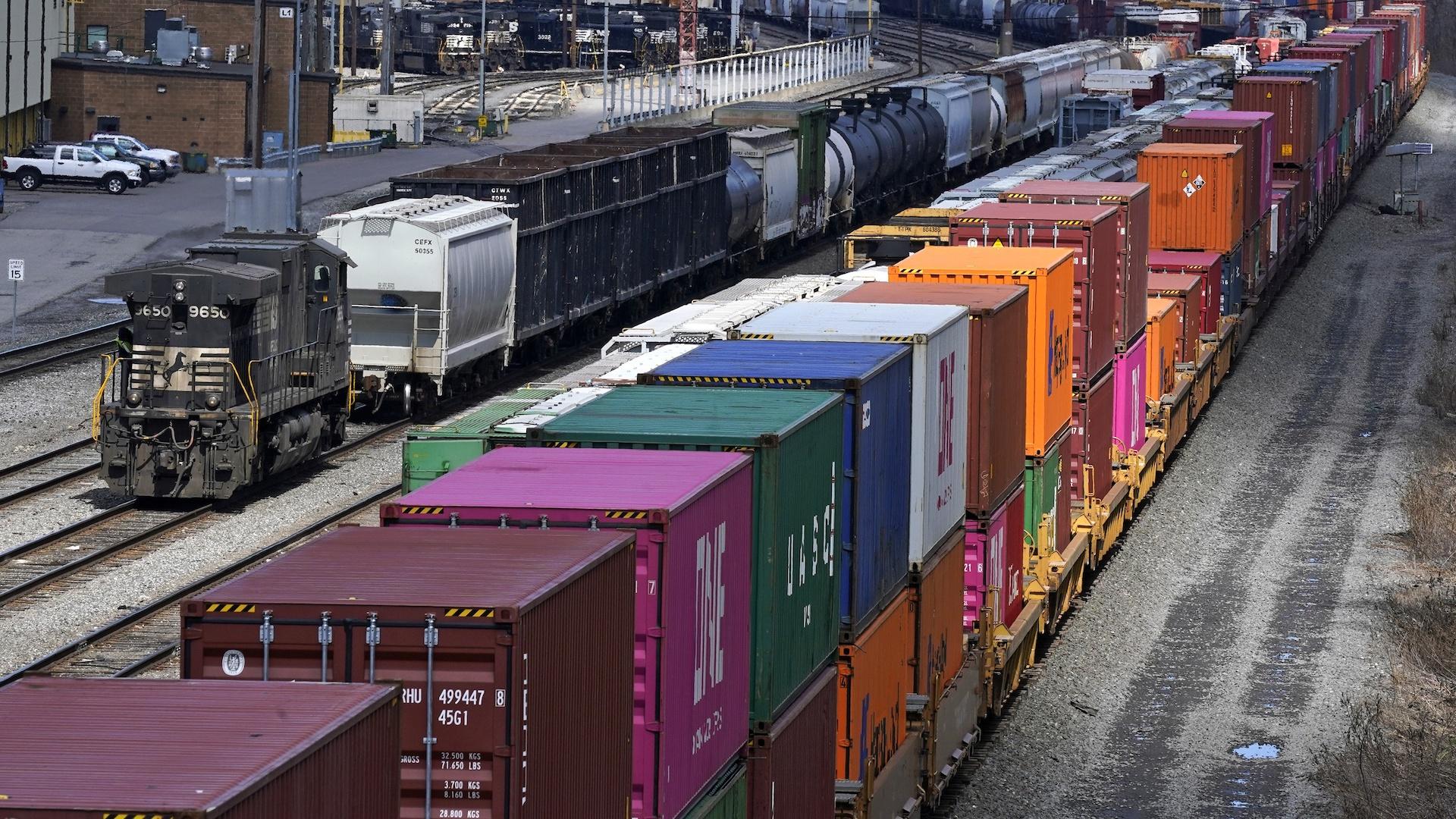This April 2, 2021, file photo shows freight train cars and containers at Norfolk Southern Railroad's Conway Yard in Conway, Pa. Railroad engineers accepted their deal with the railroads that will deliver 24% raises but conductors rejected the contract casting more doubt on whether the industry will be able to resolve the labor dispute before next month’s deadline without Congress’ help. (AP Photo/Gene J. Puskar, File)