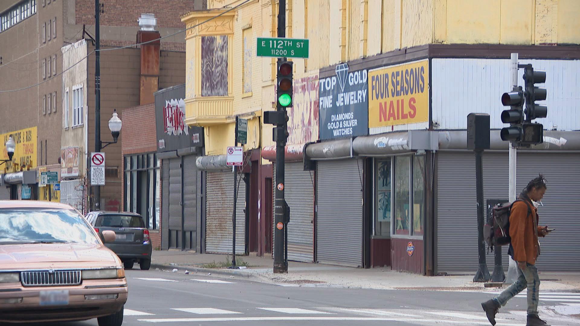 A lone pedestrian crosses the street in Chicago’s Roseland neighborhood in May.  (WTTW News)