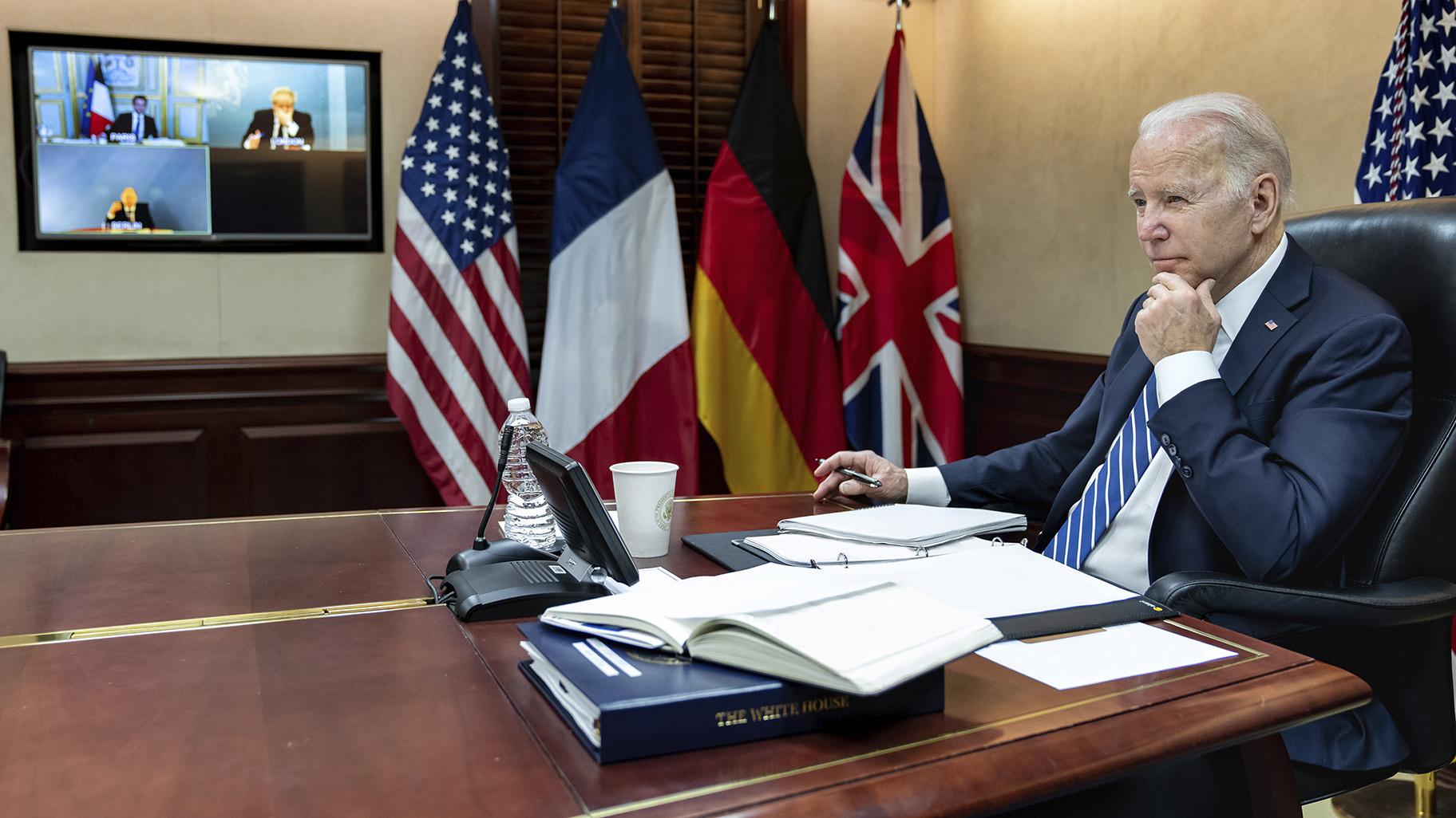 In this image provided by the White House, President Joe Biden listens during a secure video call with French President Emmanuel Macron, German Chancellor Olaf Scholz and British Prime Minister Boris Johnson in the Situation Room at the White House Monday, March 7, 2022, in Washington. (Adam Schultz / The White House via AP)