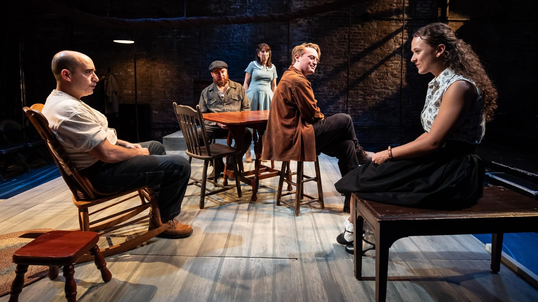 From left, Scott Aiello plays Eddie, Mike Cherry is Marco, Eileen Niccolai plays Beatrice, Harrison Weger is Rodolpho, who has his eye on Catherine, Isabelle Muthiah is Catherine in Shattered Globe Theatre’s “A View From the Bridge.” (Credit: Liz Lauren)