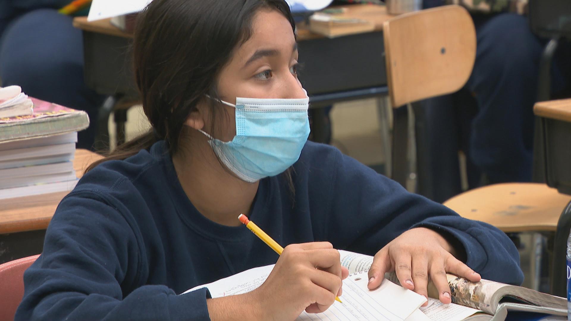 A student wears a mask at Sacred Heart School in the city’s South Deering neighborhood. (WTTW News)