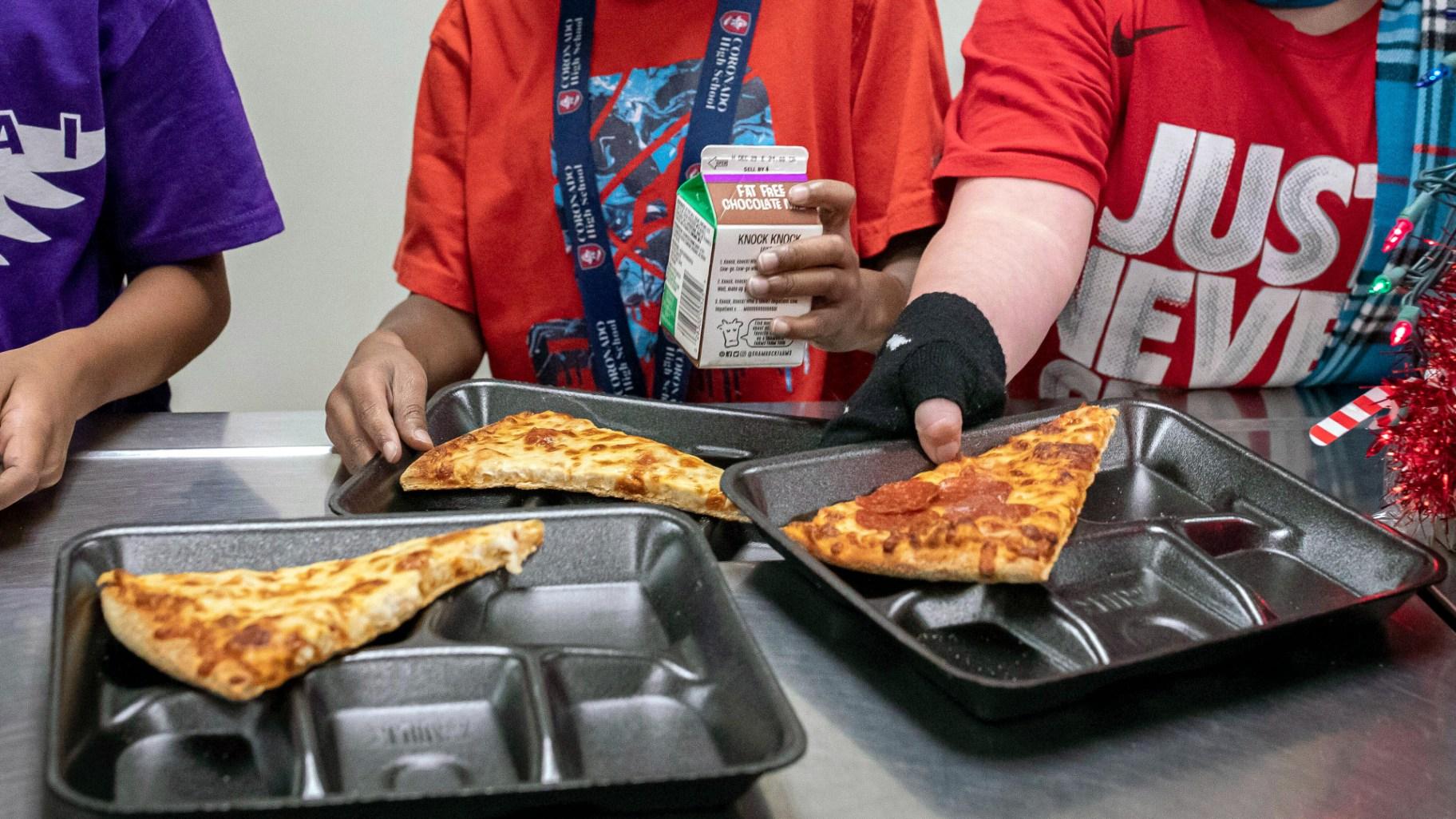 FILE - Second-grade students select their meals during lunch break in the cafeteria at an elementary school in Scottsdale, Ariz., Dec. 12, 2022. (AP Photo / Alberto Mariani, File)
