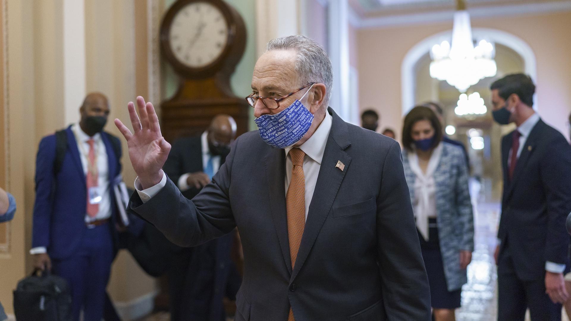 On the first full day of Democratic control, Senate Majority Leader Chuck Schumer, D-N.Y., walks to the chamber after meeting with new senators from his caucus, at the Capitol in Washington, Thursday, Jan. 21, 2021. (AP Photo/J. Scott Applewhite)
