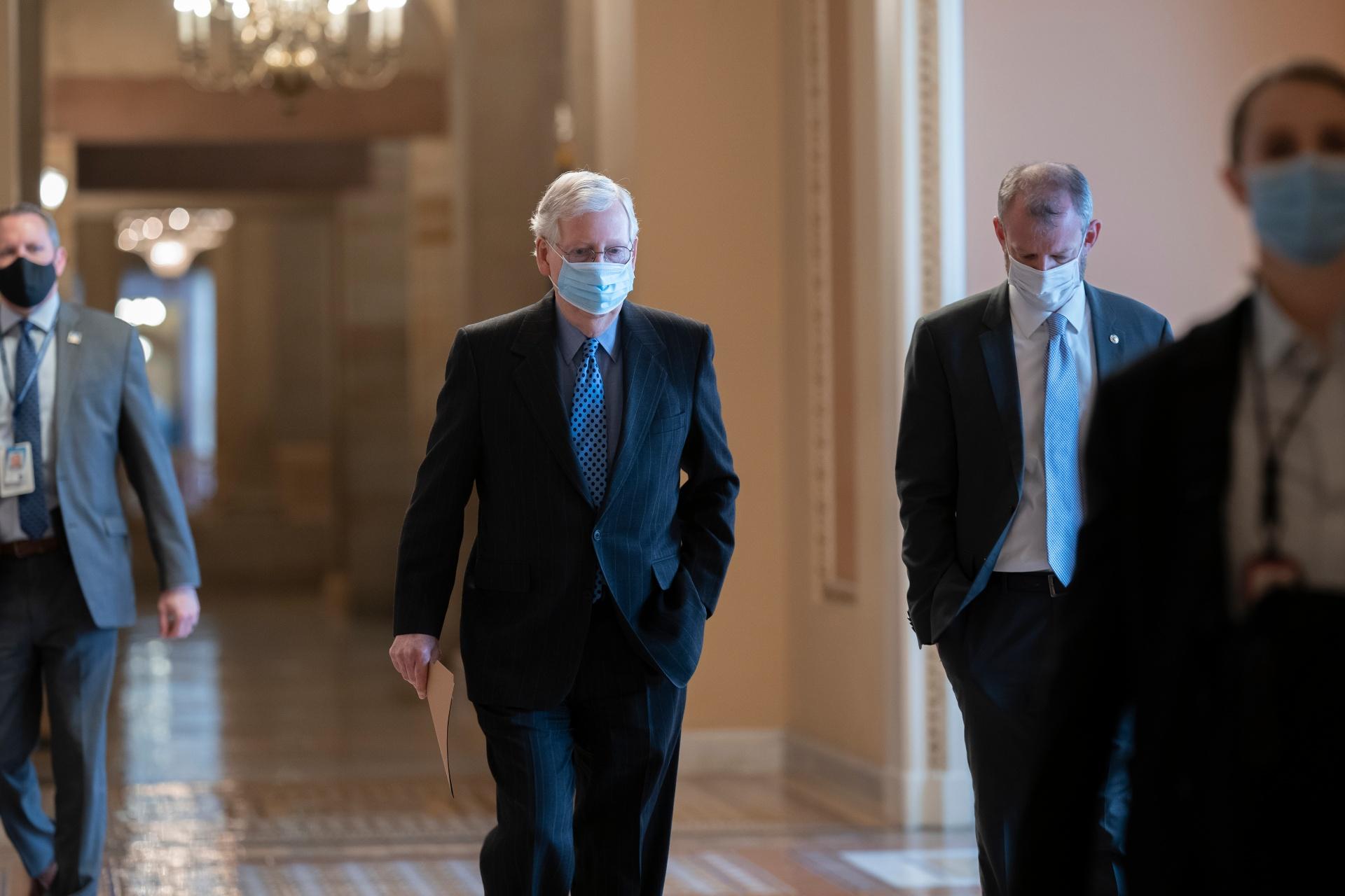 On the first full day of the new Democratic majority in the Senate, Sen. Mitch McConnell, R-Ky., the top Republican, walks to the chamber for the start of business as the minority leader, at the Capitol in Washington, Thursday, Jan. 21, 2021. (AP Photo / J. Scott Applewhite)