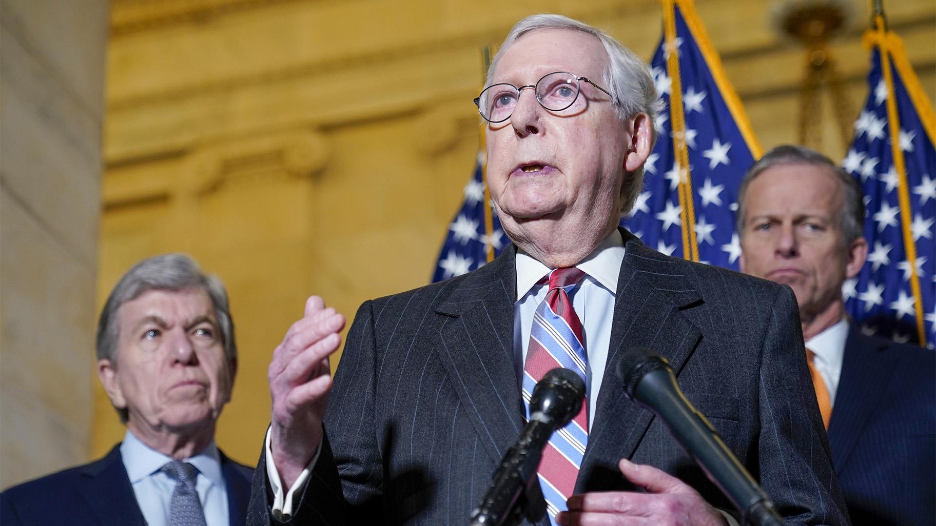 Senate Minority Leader Mitch McConnell of Ky., center, speaks to reporters on Capitol Hill in Washington, Tuesday, Feb. 8, 2022. Standing with McConnell is Sen. Roy Blunt, R-Mo., left, and Sen. John Thune, R-S.D., right. (AP Photo / Susan Walsh)