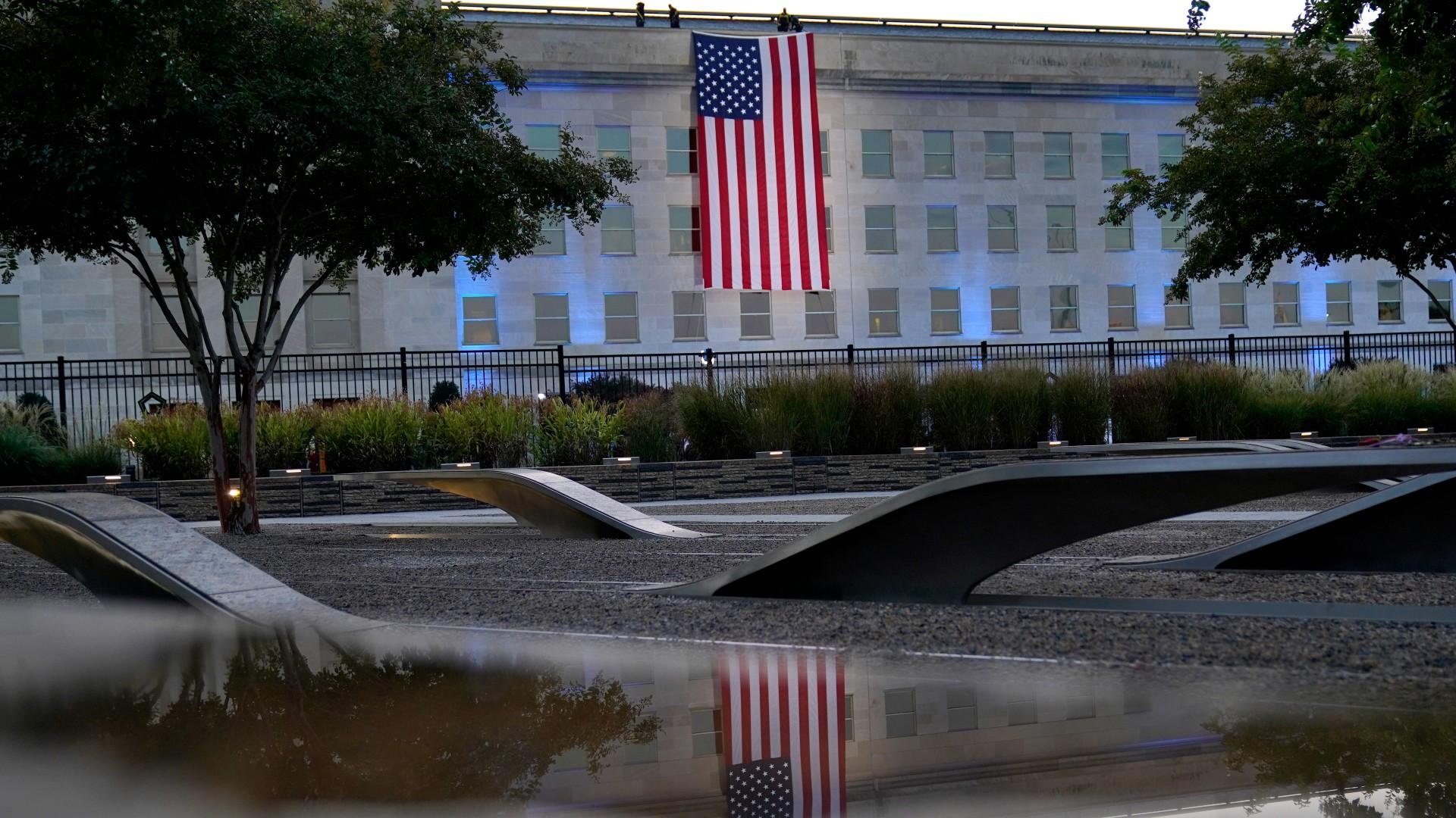 An American flag is unfurled at the Pentagon in Washington, Saturday, Sept. 11, 2021, at sunrise on the morning of the 20th anniversary of the terrorist attacks. (AP Photo / Alex Brandon)