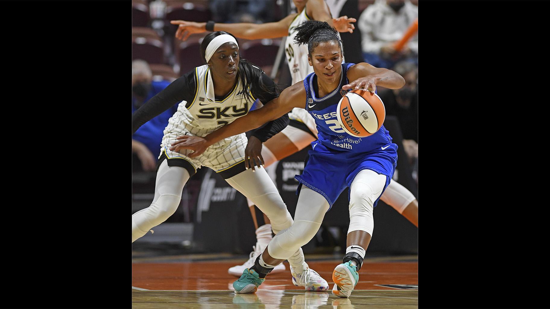 Connecticut Sun forward Alyssa Thomas, right, fends off Chicago Sky defender Kahleah Copper during a WNBA playoff basketball game Thursday, Sept. 30, 2021 at Mohegan Sun Arena in Uncasville, Conn. (Sean D. Elliot/The Day via AP)