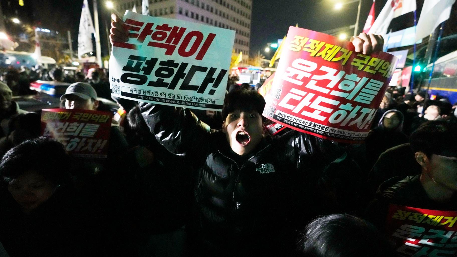 A man shouts to demand South Korean President Yoon Suk Yeol to step down in front of the National Assembly in Seoul, South Korea, Wednesday, Dec. 4, 2024. (Ahn Young-joon / AP Photo)
