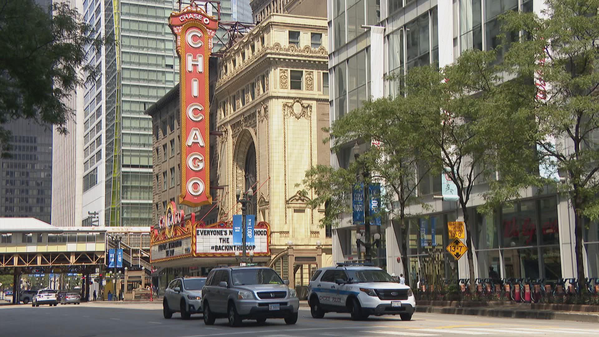 Chicago Police vehicles are seen on an otherwise quiet State Street in Chicago on Monday Aug. 10, 2020, hours after looting and property damage swept through downtown streets. (WTTW News)