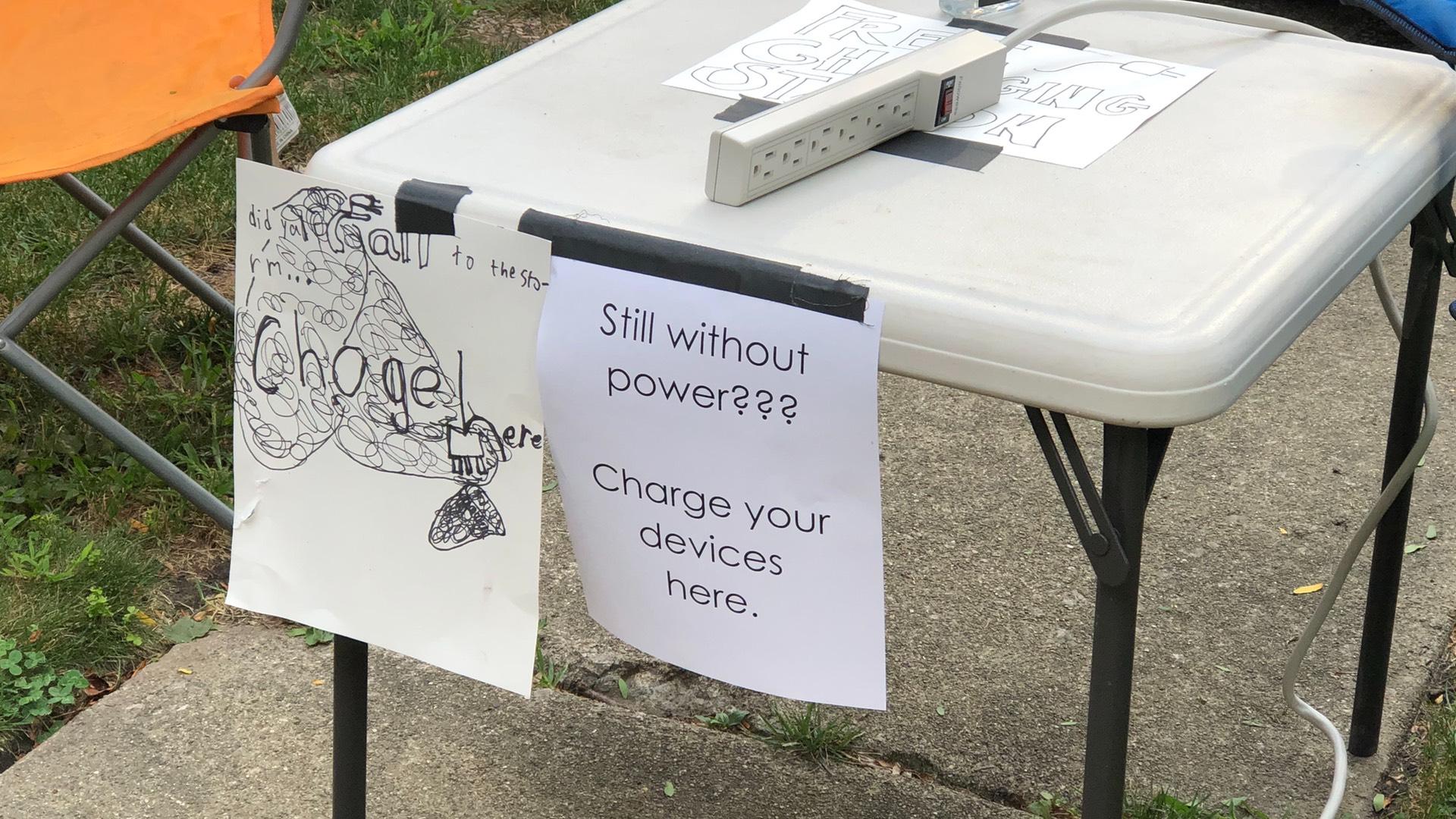 Neighbors with power have set up charging stations for those without in the Lincoln Square community. (Patty Wetli / WTTW News)