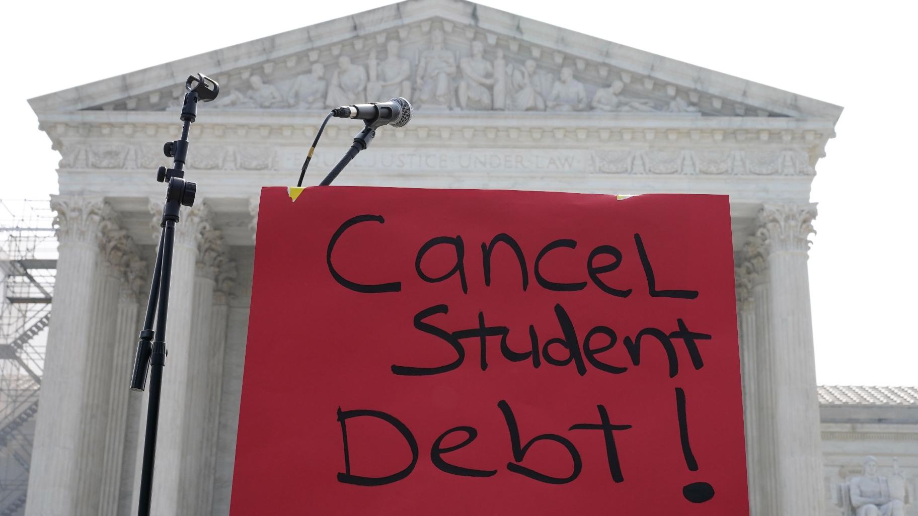 A sign reading “cancel student debt” is seen outside the Supreme Court, Friday, June 30, 2023 in Washington. (AP Photo / Mariam Zuhaib)