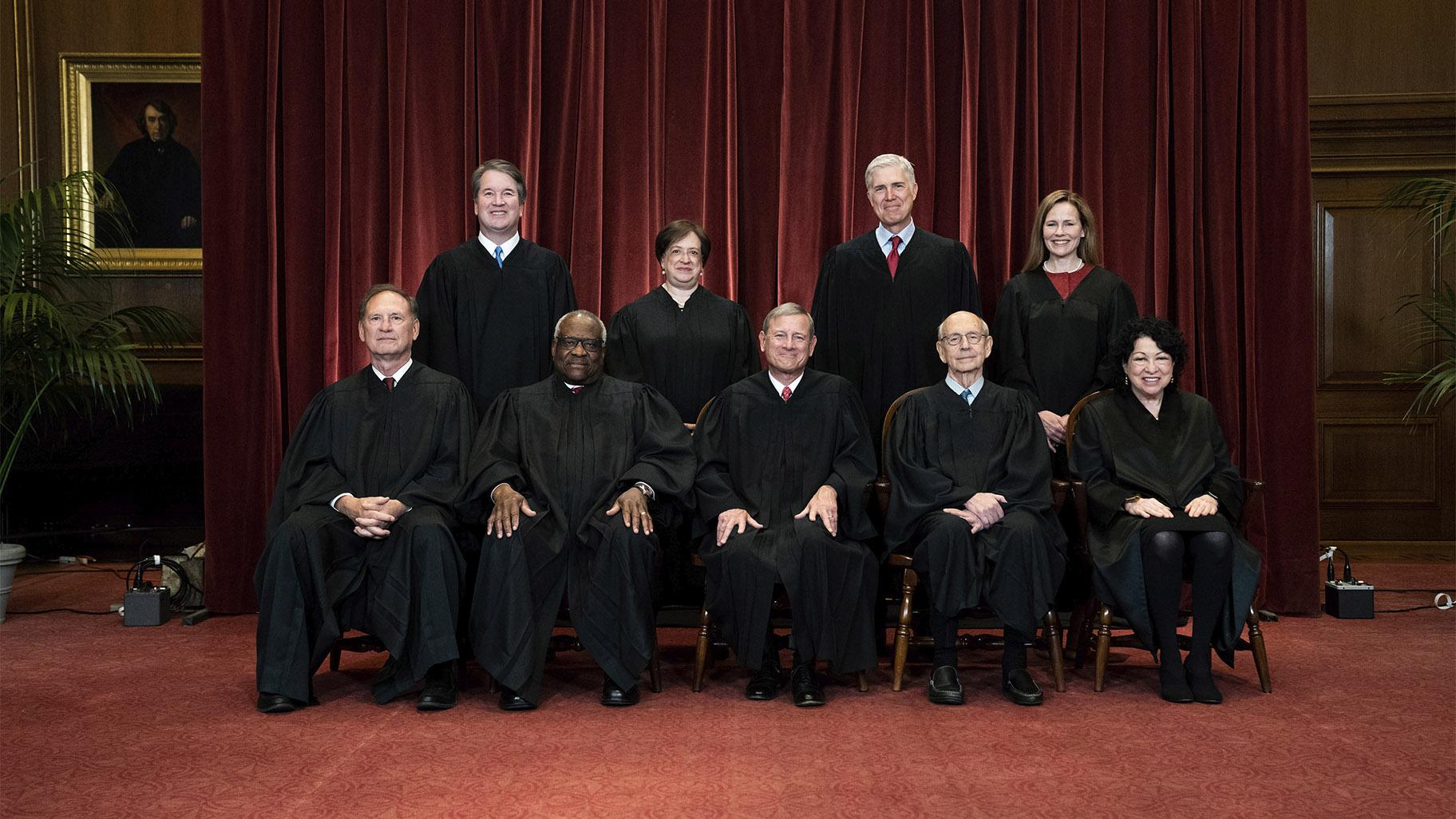 FILE - On April 23, 2021, members of the Supreme Court File Photo pose for a group photo at the Supreme Court in Washington.  Seated from left to right are Associate Judge Samuel Alito, Associate Judge Clarence Thomas, Chief Justice John Roberts, Associate Judge Stephen Breyer and Associate Judge Sonia Sotomayor, Standing from left are Associate Judge Brett Kavanaugh, Associate Judge Elena Kagan, Associate Judge Neil Gorsuch and Associate Judge Amy Coney Barrett.  (Erin Schaff via AP)
