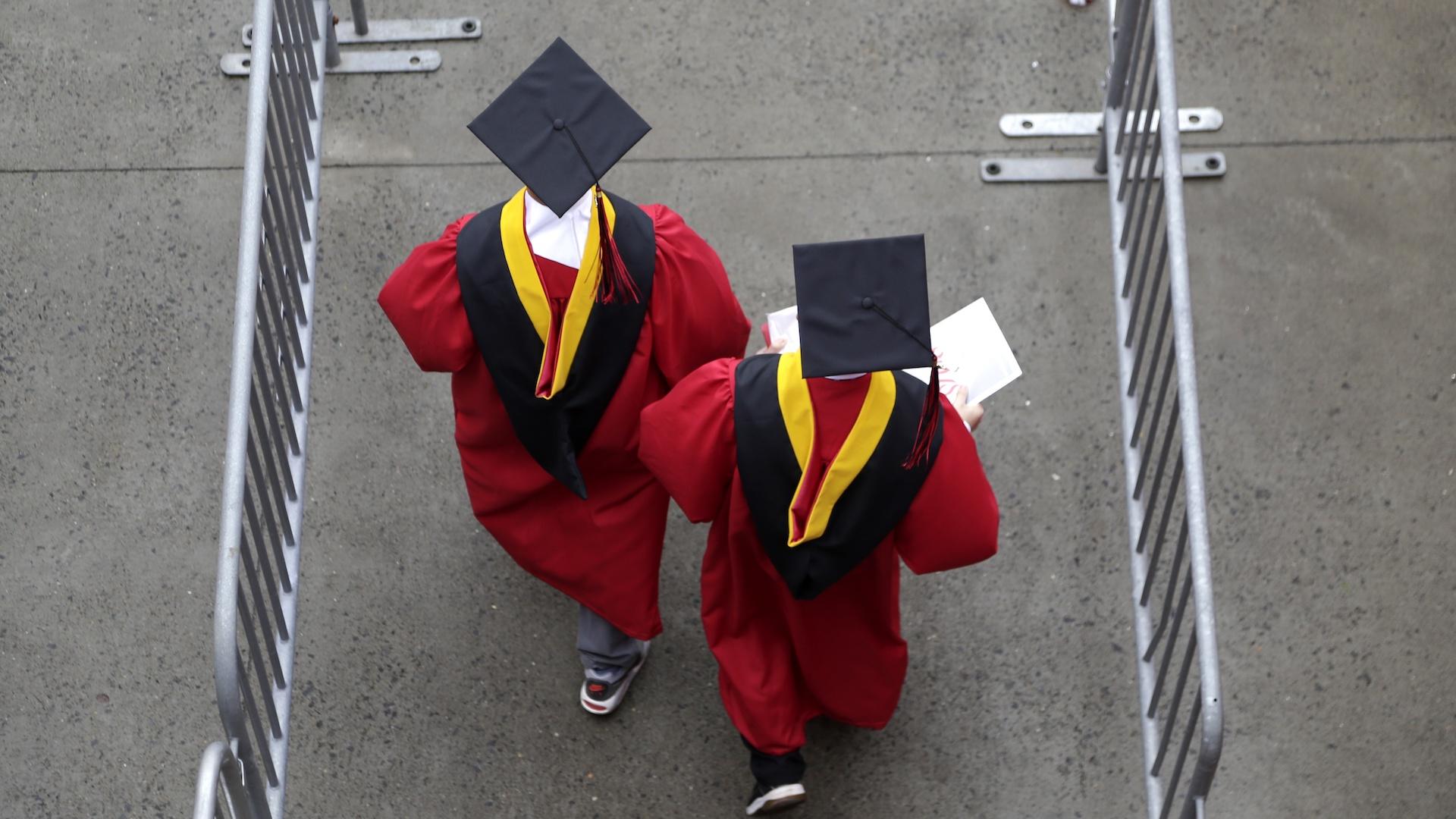 New graduates walk into the High Point Solutions Stadium before the start of the Rutgers University graduation ceremony in Piscataway Township, N.J., on May 13, 2018.  (AP Photo/Seth Wenig, File)
