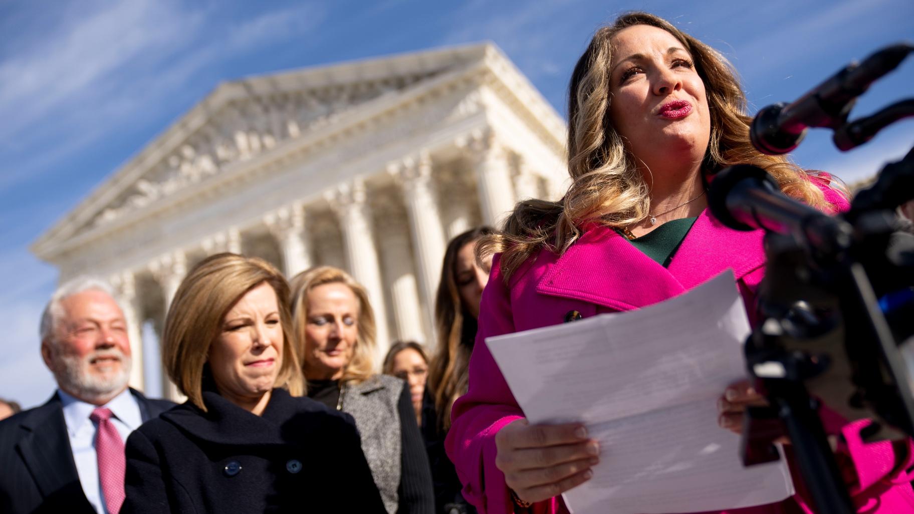 Lorie Smith, a Christian graphic artist and website designer in Colorado, right, accompanied by her lawyer, Kristen Waggoner of the Alliance Defending Freedom, second from left, speaks outside the Supreme Court in Washington, Monday, Dec. 5, 2022, after her case was heard before the Supreme Court. (AP Photo / Andrew Harnik, File)