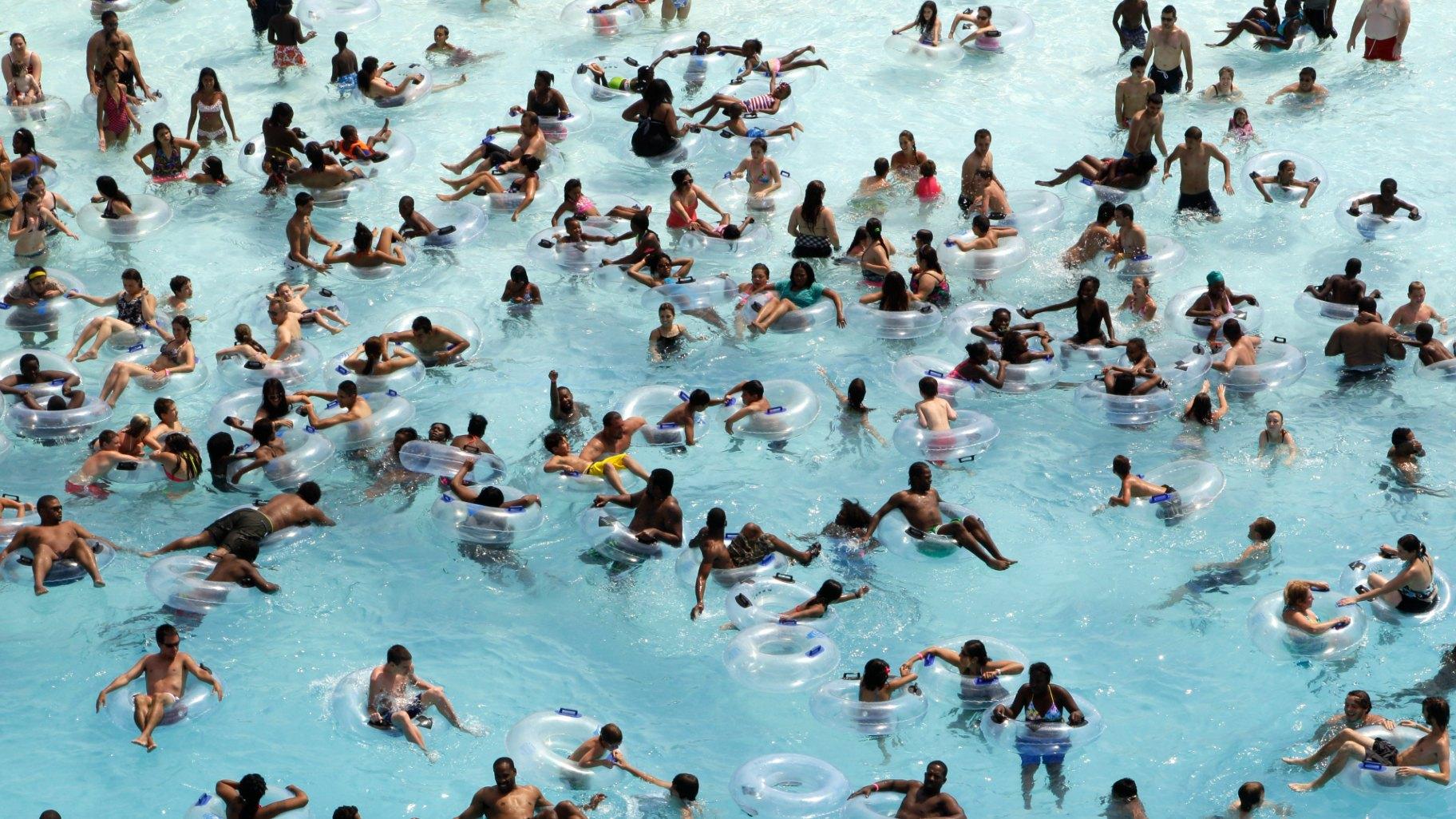 FILE - Swimmers try to stay cool in near 100-degree temperatures at Red Oaks Waterpark in Madison Heights, Mich., June 28, 2012. (Paul Sancya / AP Photo, File)