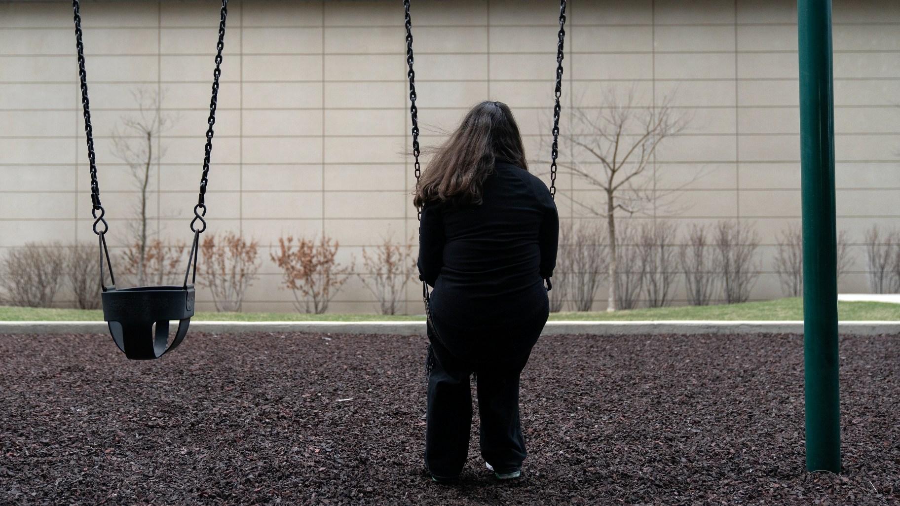 Amelia, 16, sits for a portrait in a park near her home in Illinois on Friday, March 24, 2023. “We are so strong and we go through so, so much," says the teenage girl who loves to sing and wants to be a surgeon. Amelia has also faced bullying, toxic friendships, and menacing threats from a boy at school who said she “deserved to be raped.” (AP Photo Erin Hooley)